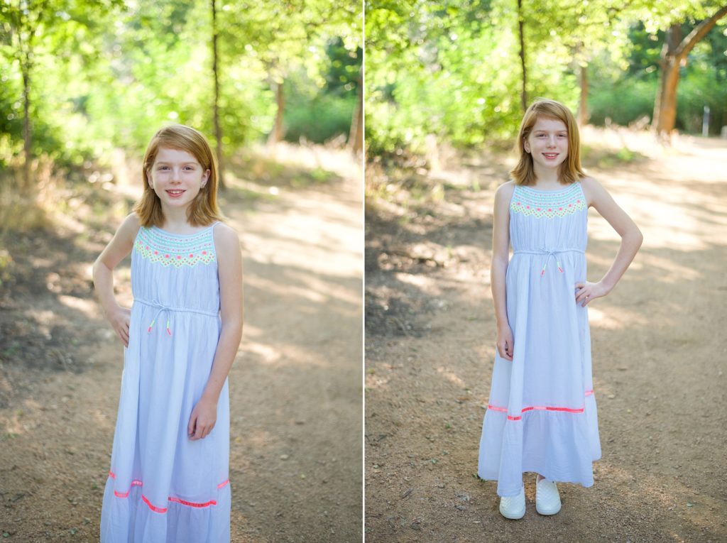 girl in blue dress stands with hands on hip during Little Elm family photo session