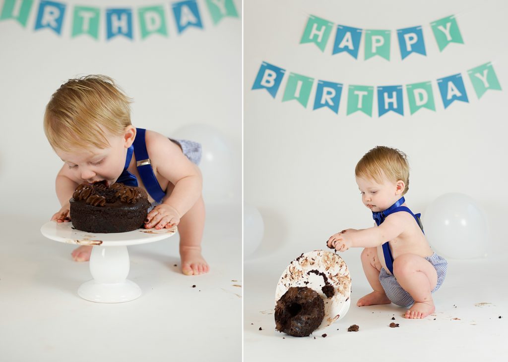 one year old plays with chocolate cake