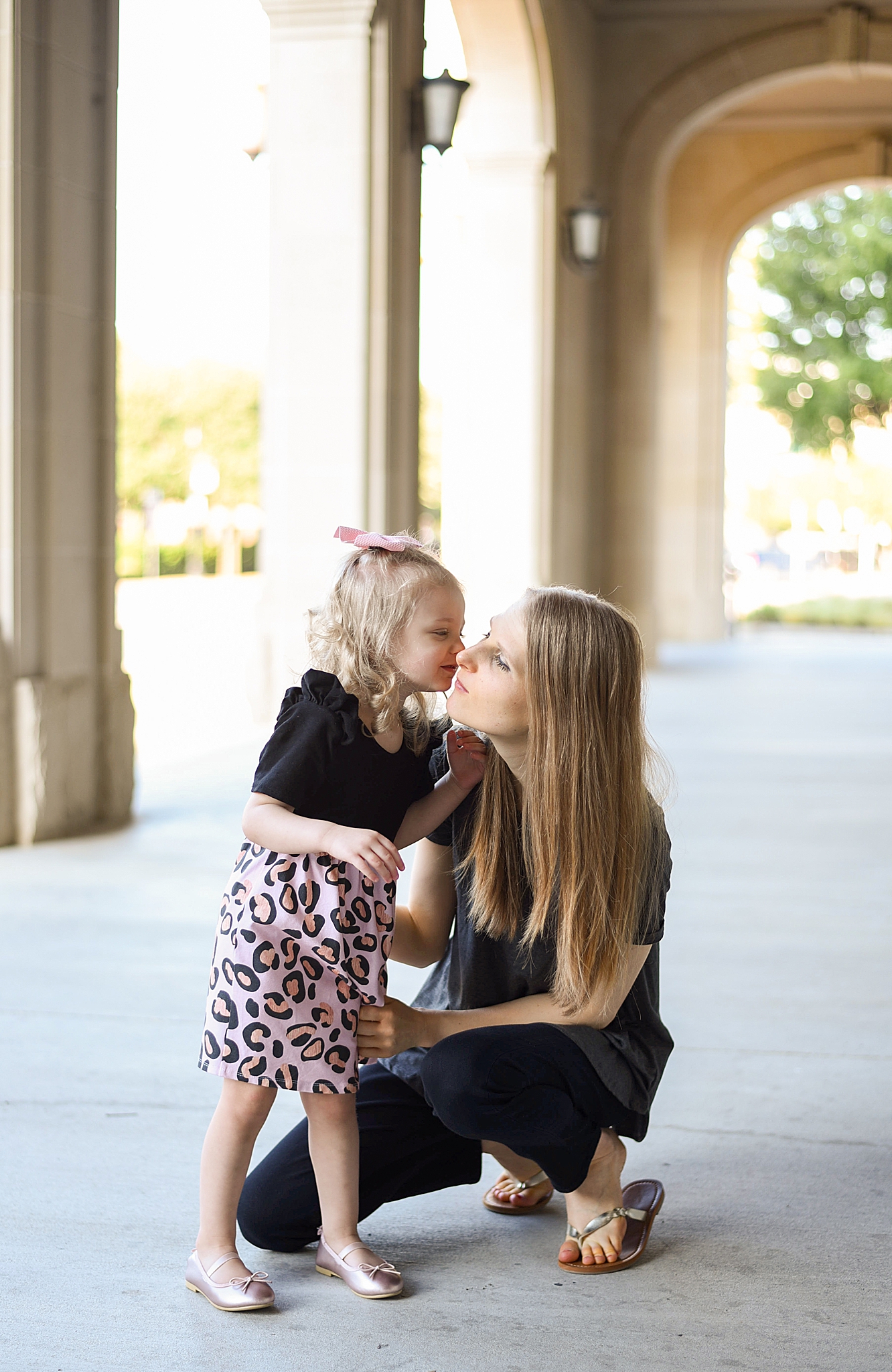 mom and daughter hug during Frisco Square family portraits