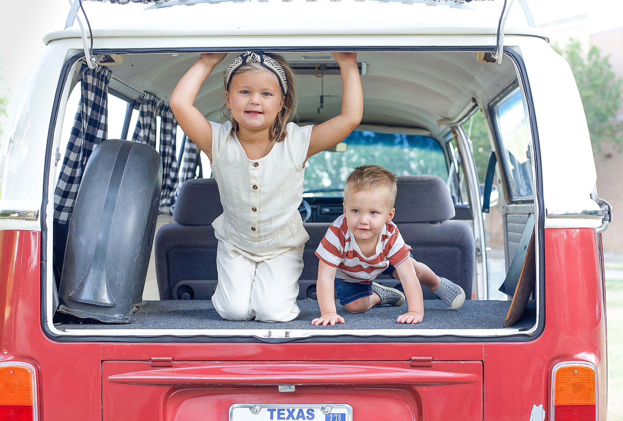 kids pose in back of VW van during Little Elm family photos
