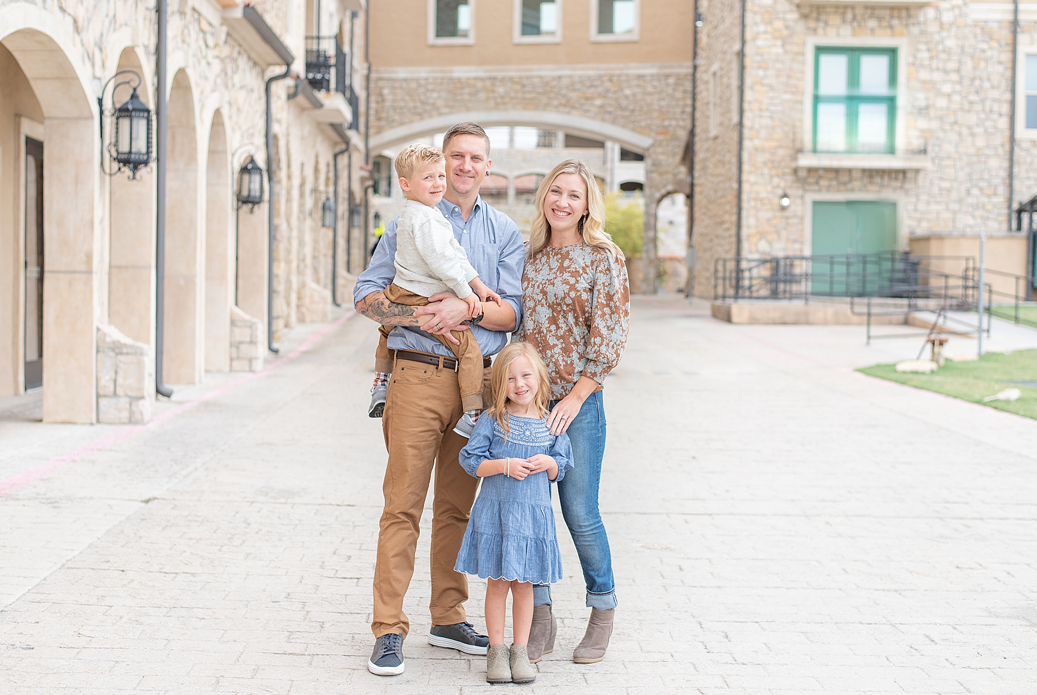 family of four poses in McKinney TX village 