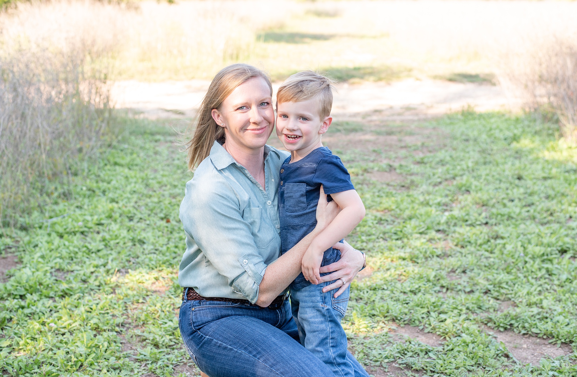 mom hugs toddler son during TX family photos