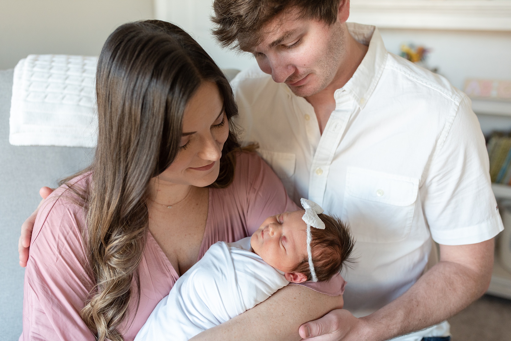 new parents look at baby girl during Aubrey TX lifestyle newborn session 