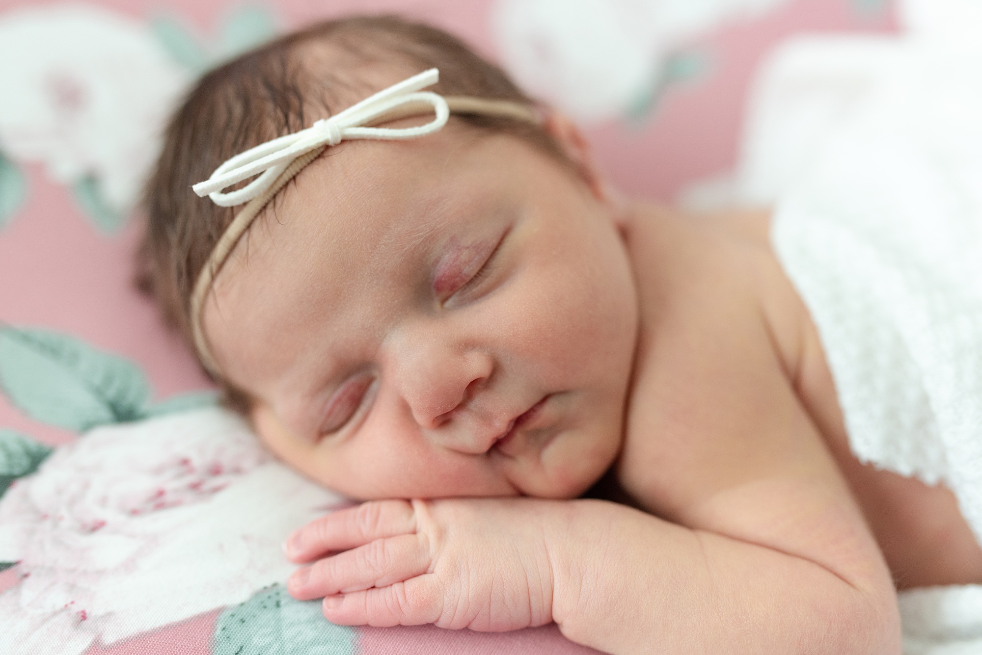 baby girls sleeps on mom's bed during Aubrey TX lifestyle newborn session 