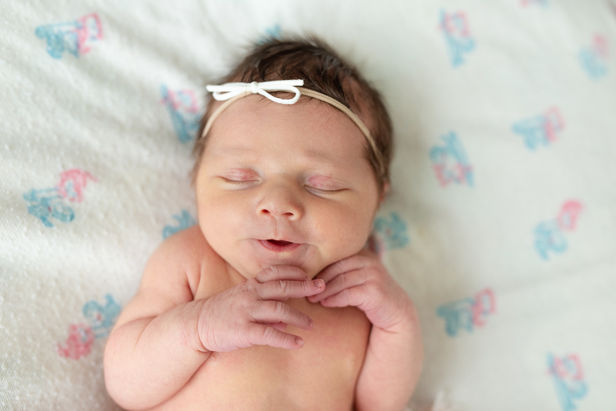 baby girls sleeps during newborn session at home