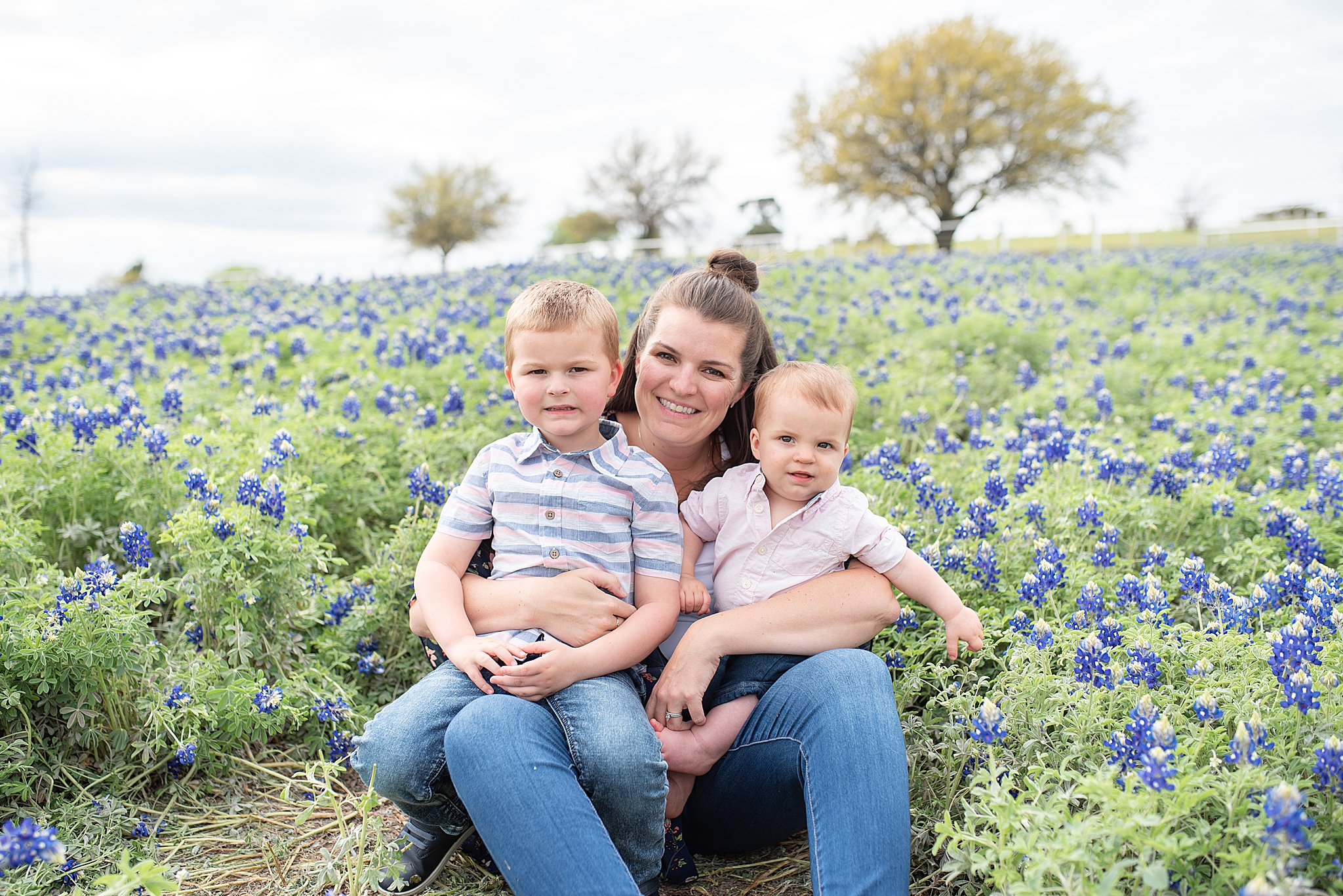 mom holds two sons during Frisco TX family photos