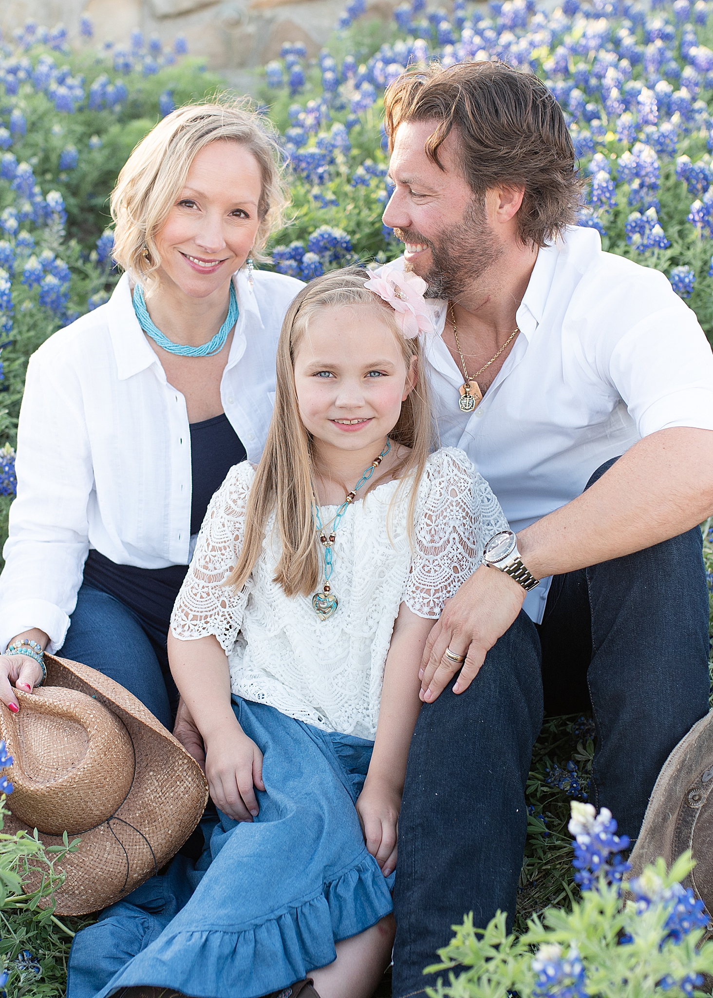 family sits together during bluebonnet mini sessions