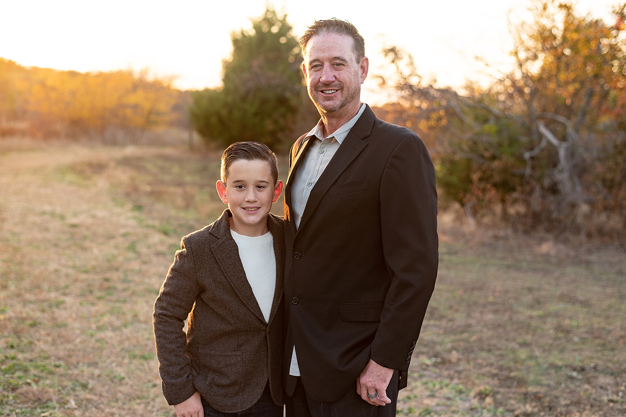 dad and son hug during TX family photos