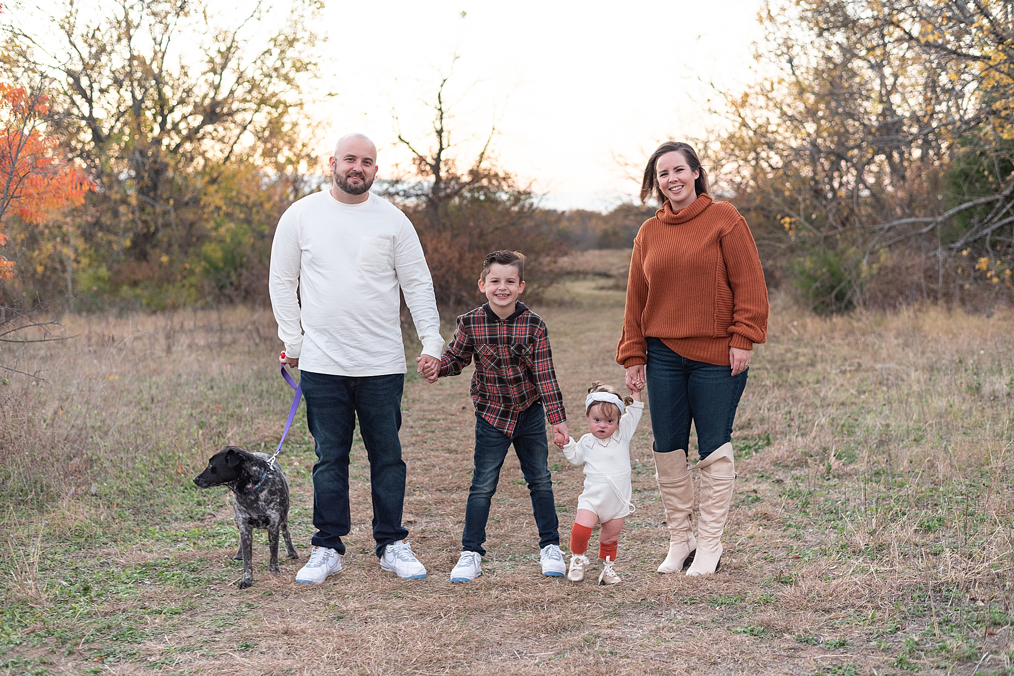 family of five poses together at sunset during Frisco Field Mini Sessions