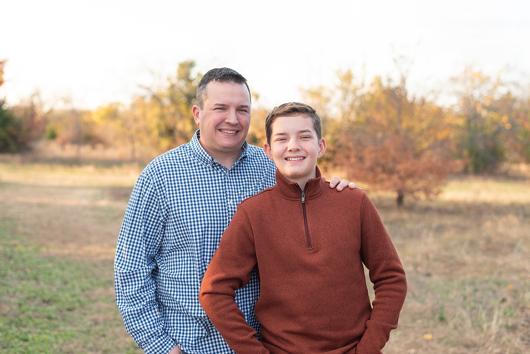 dad and son pose together during fall mini sessions
