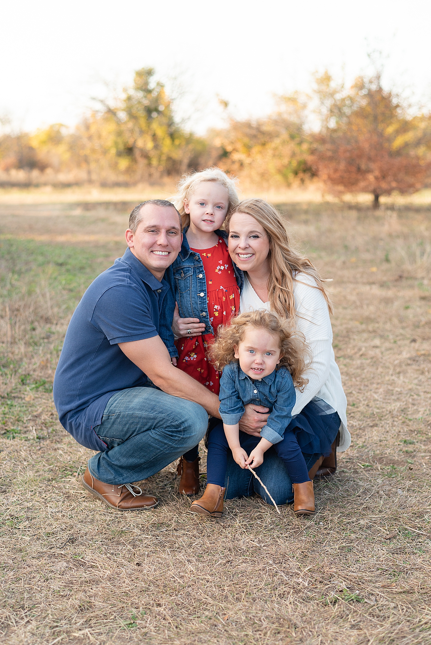 parents pose with two girls during Frisco Field Mini Sessions
