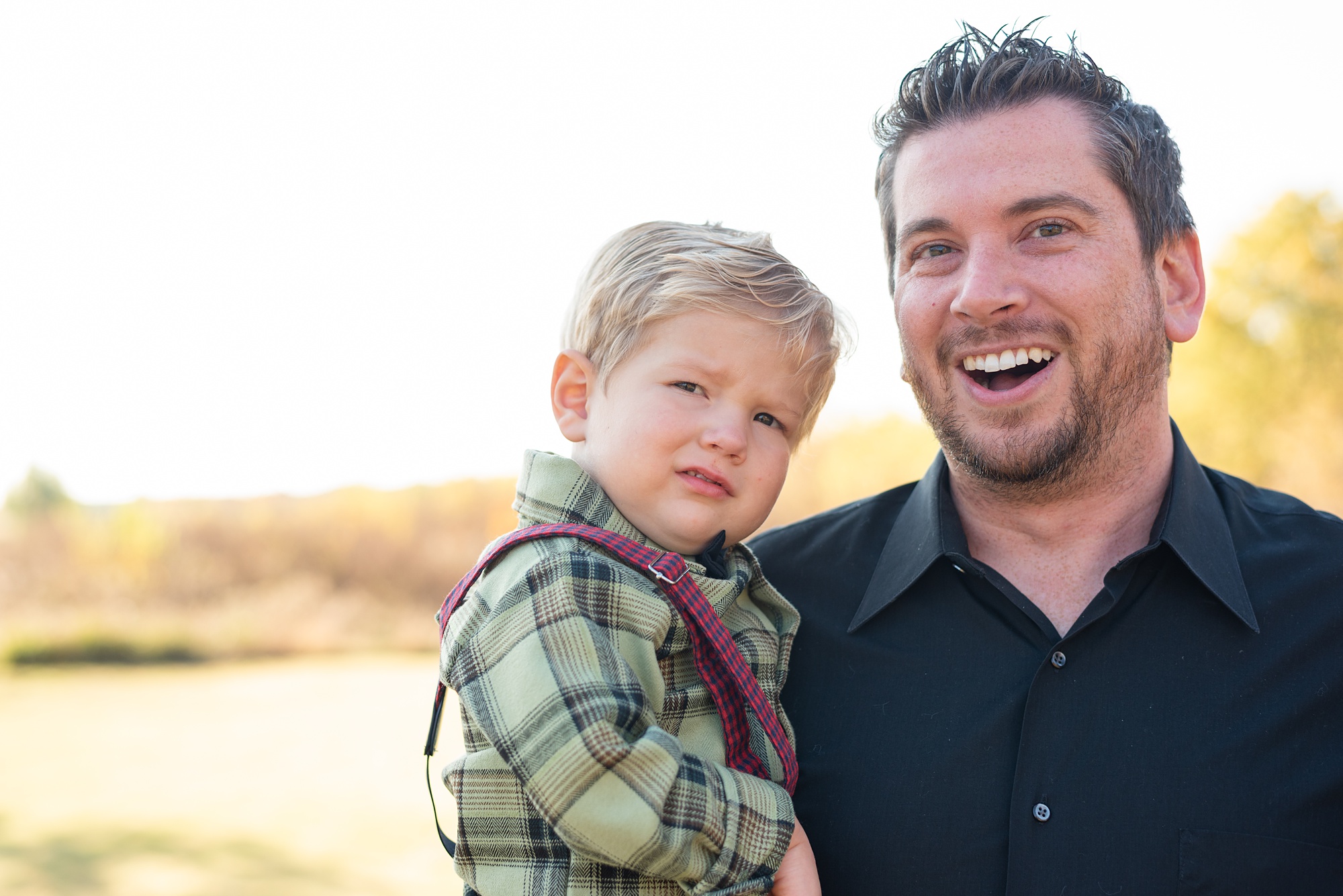 dad and son pose together during Little Elm backyard family portraits
