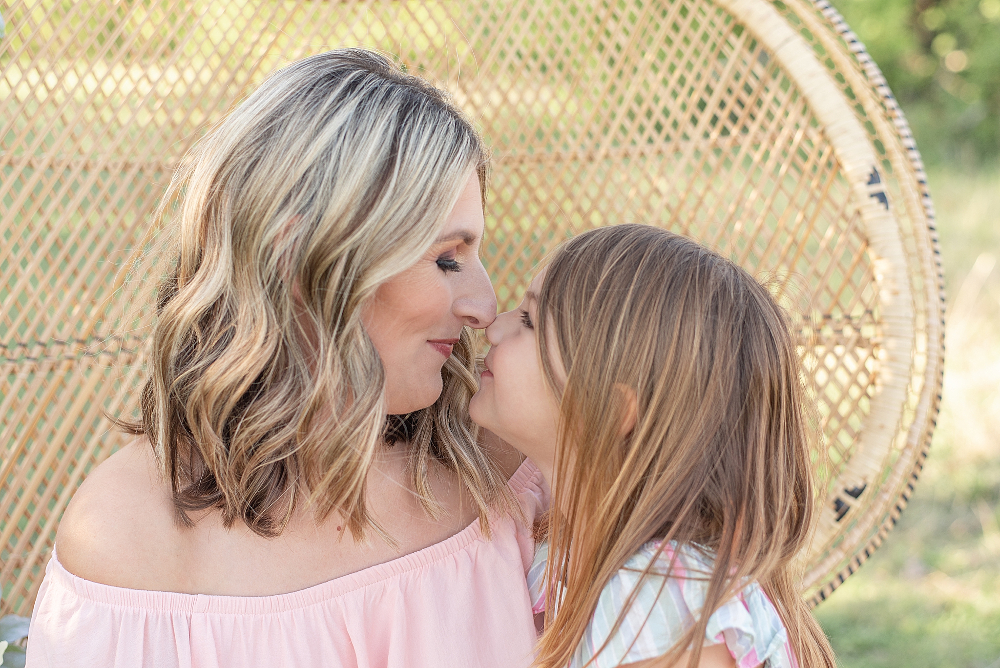 mom and daughter nuzzle noses during Frisco Field Family + Mommy and Me Session