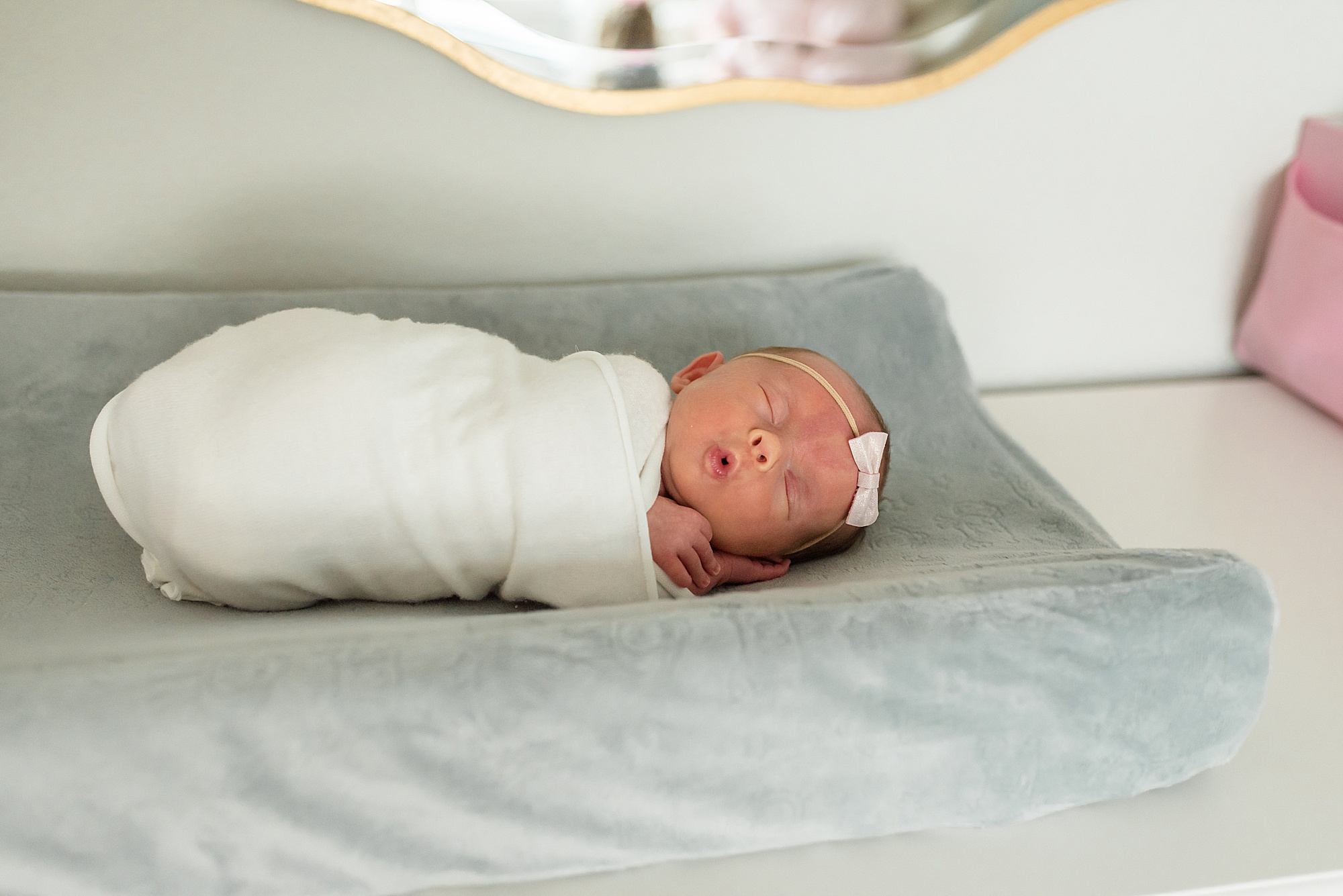 baby girl lays in nursery during Texas photo session