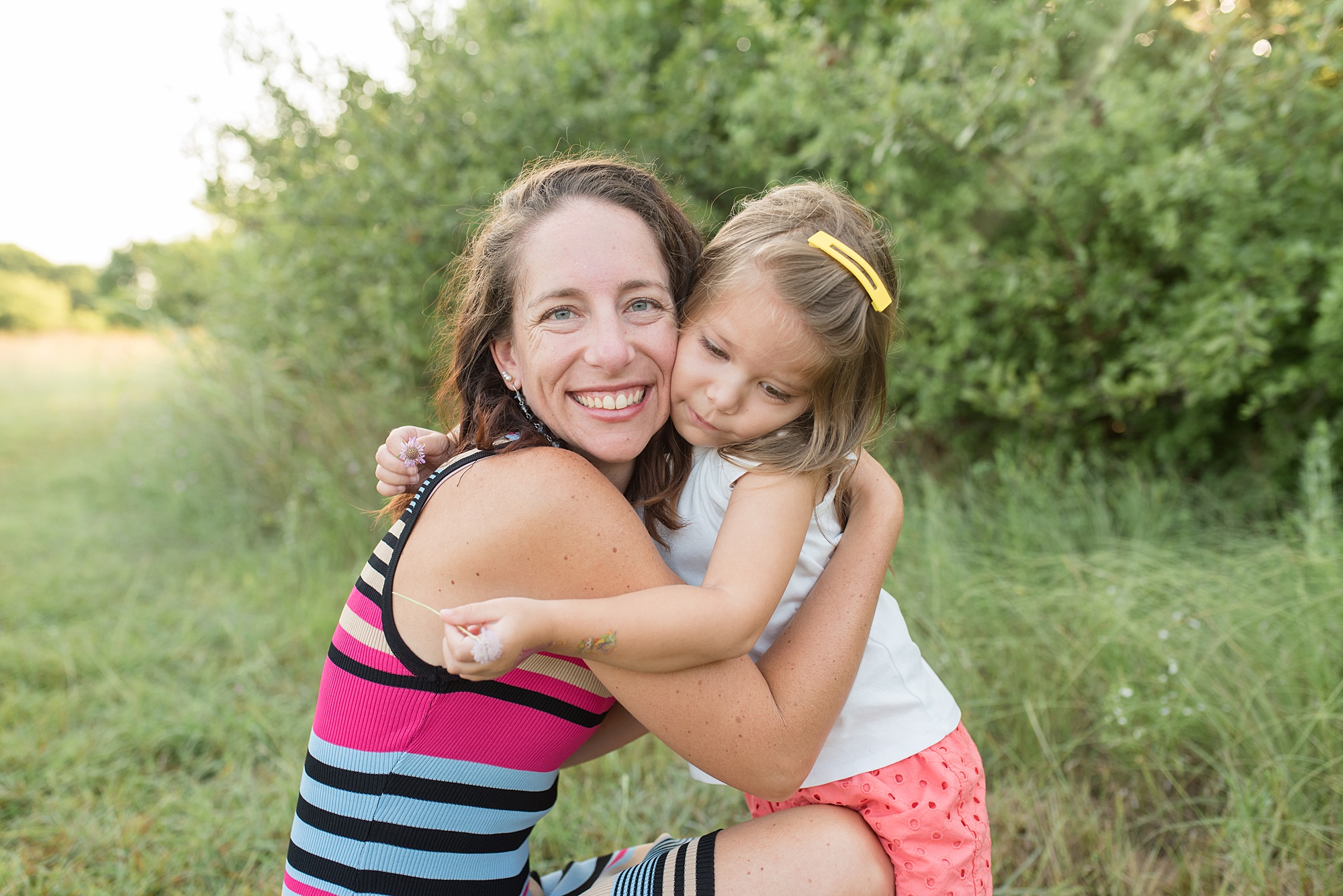 Daughter hugs her momma during Texas portrait session