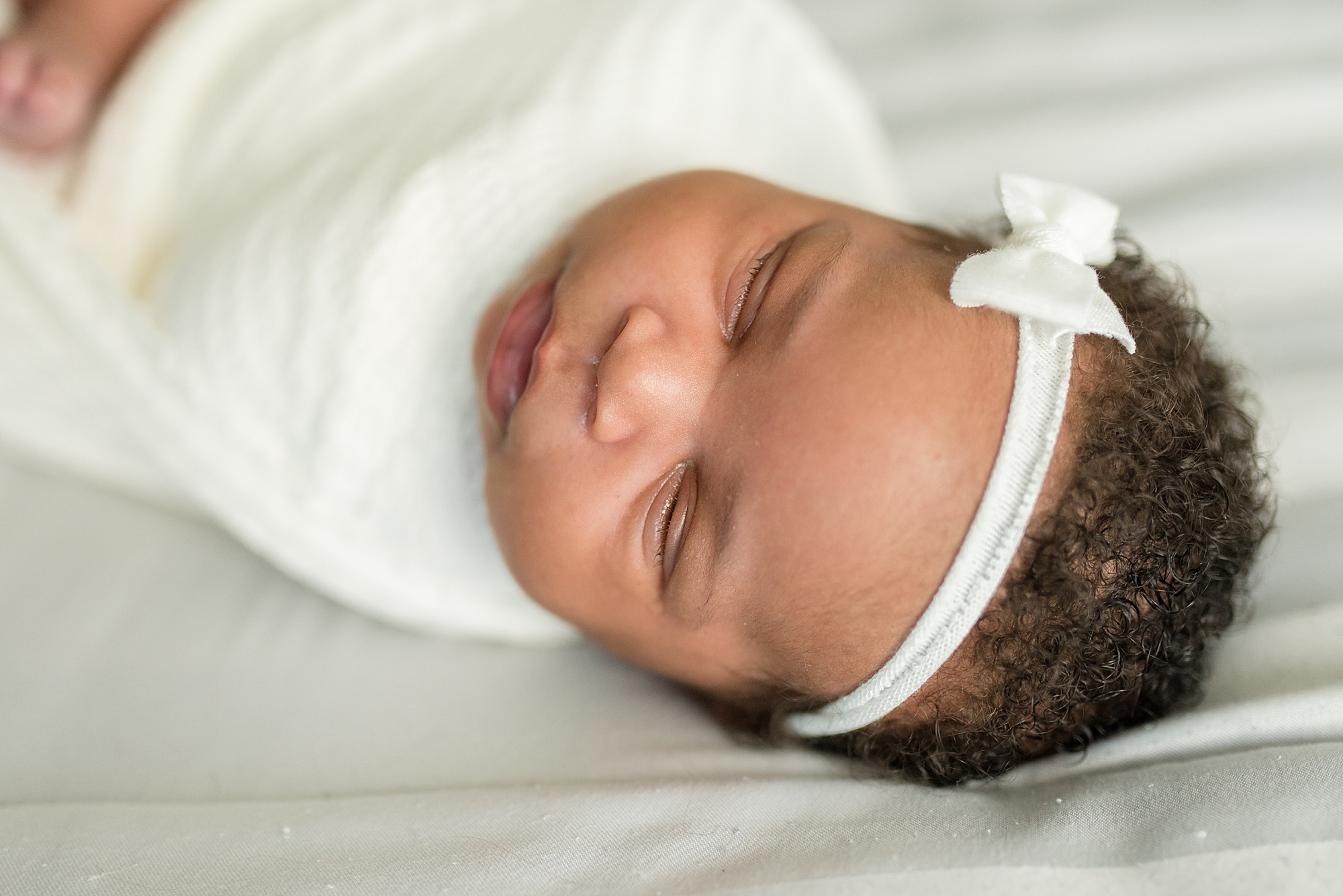 newborn baby girl sleeps during newborn portraits in Denton TX by Lindsey Dutton Photography