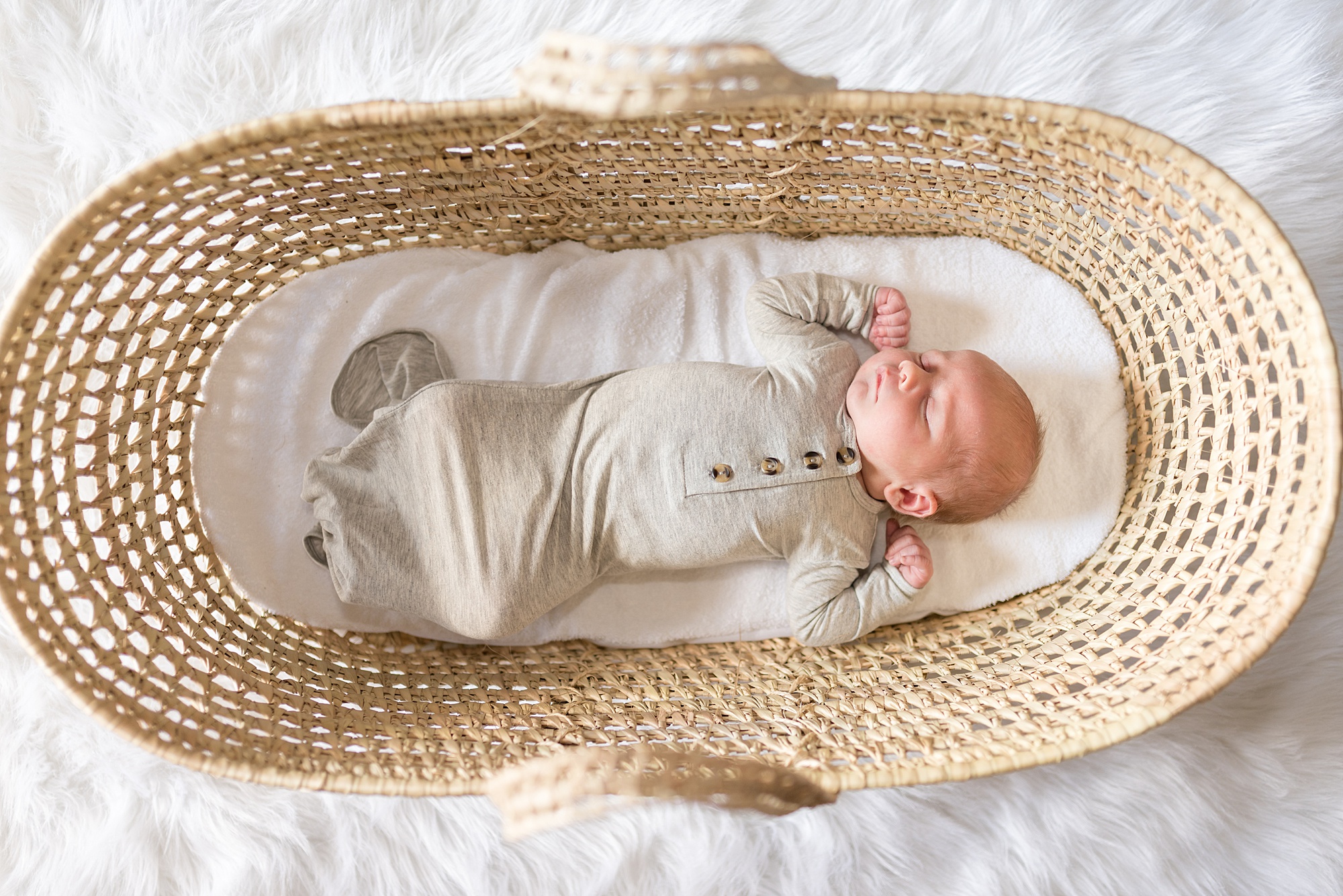 adorable newborn boy sleeps in bassinet during TX lifestyle newborn family session 