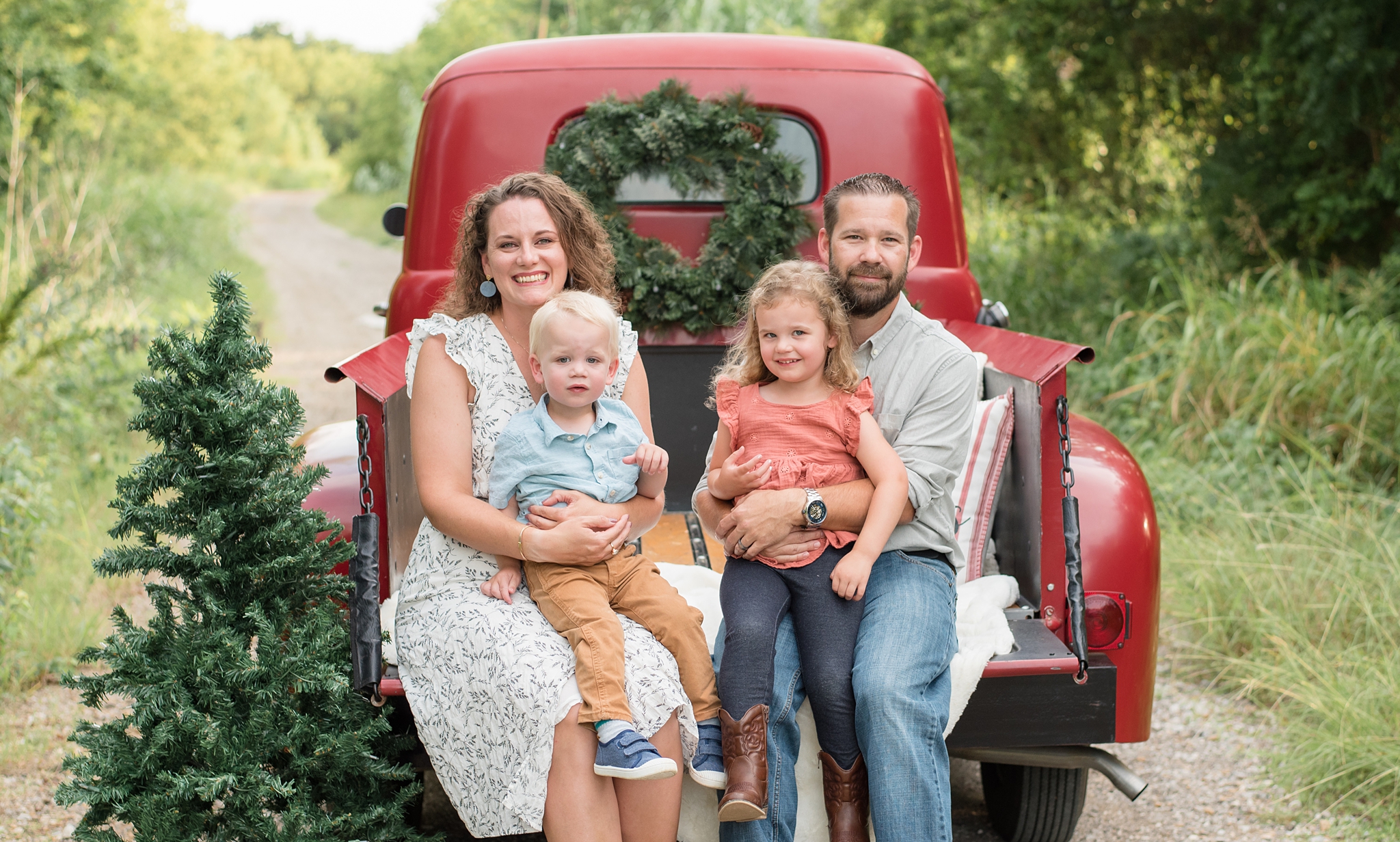 getting ready for Christmas mini session in the little red truck