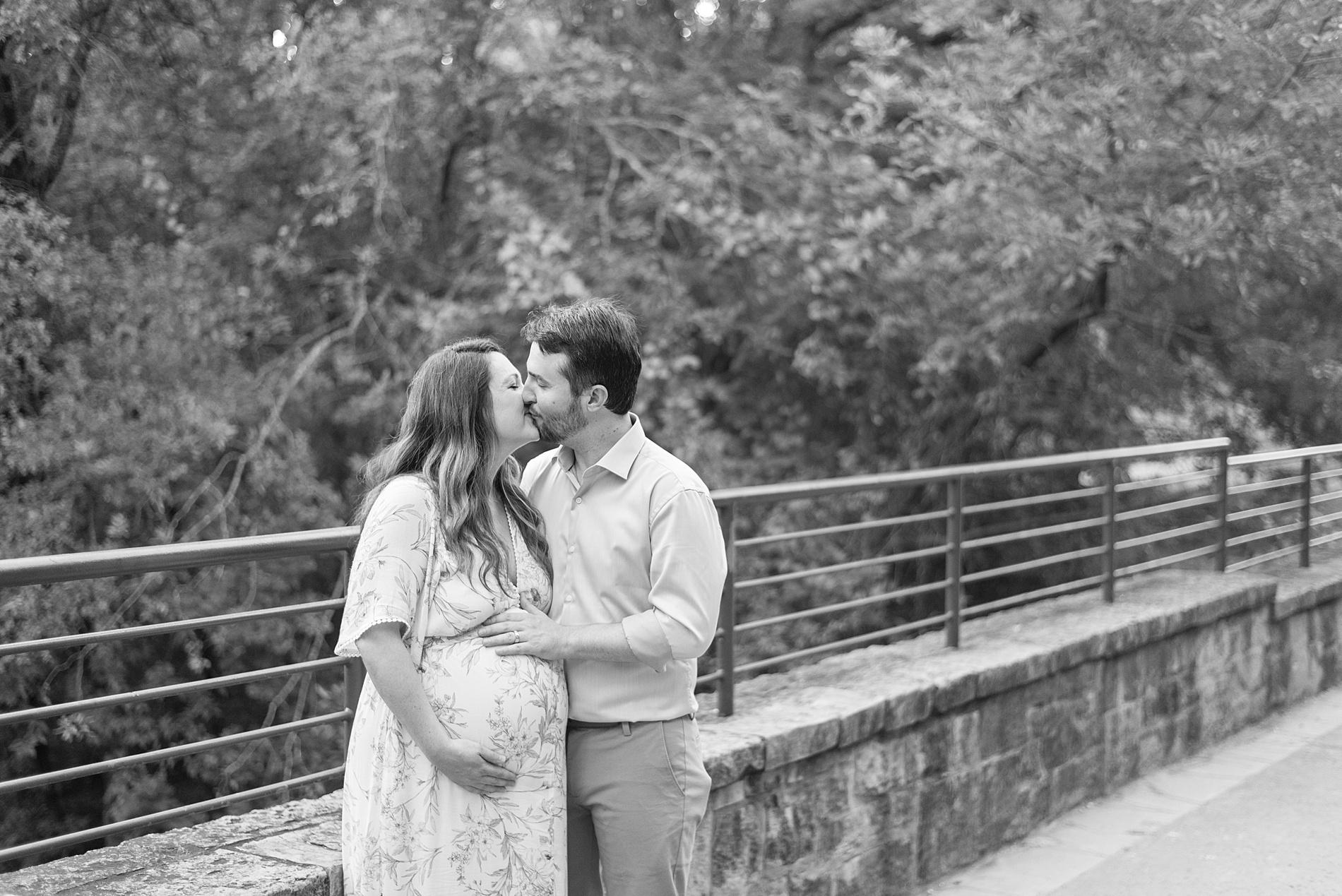 couple kisses at Arbor Hills Maternity session in TX