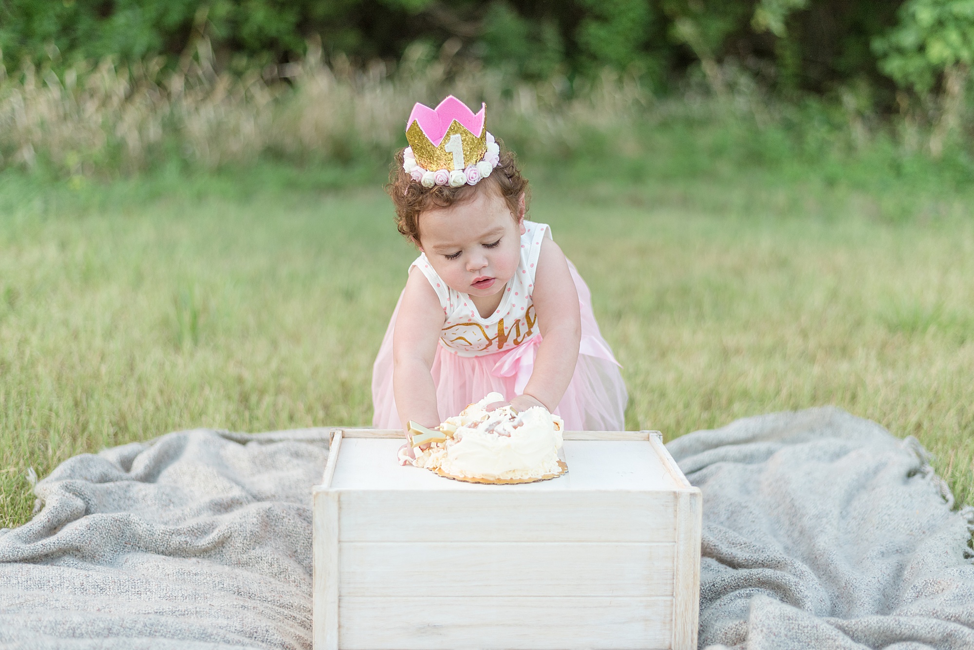 birthday girl takes her first bite of birthday cake