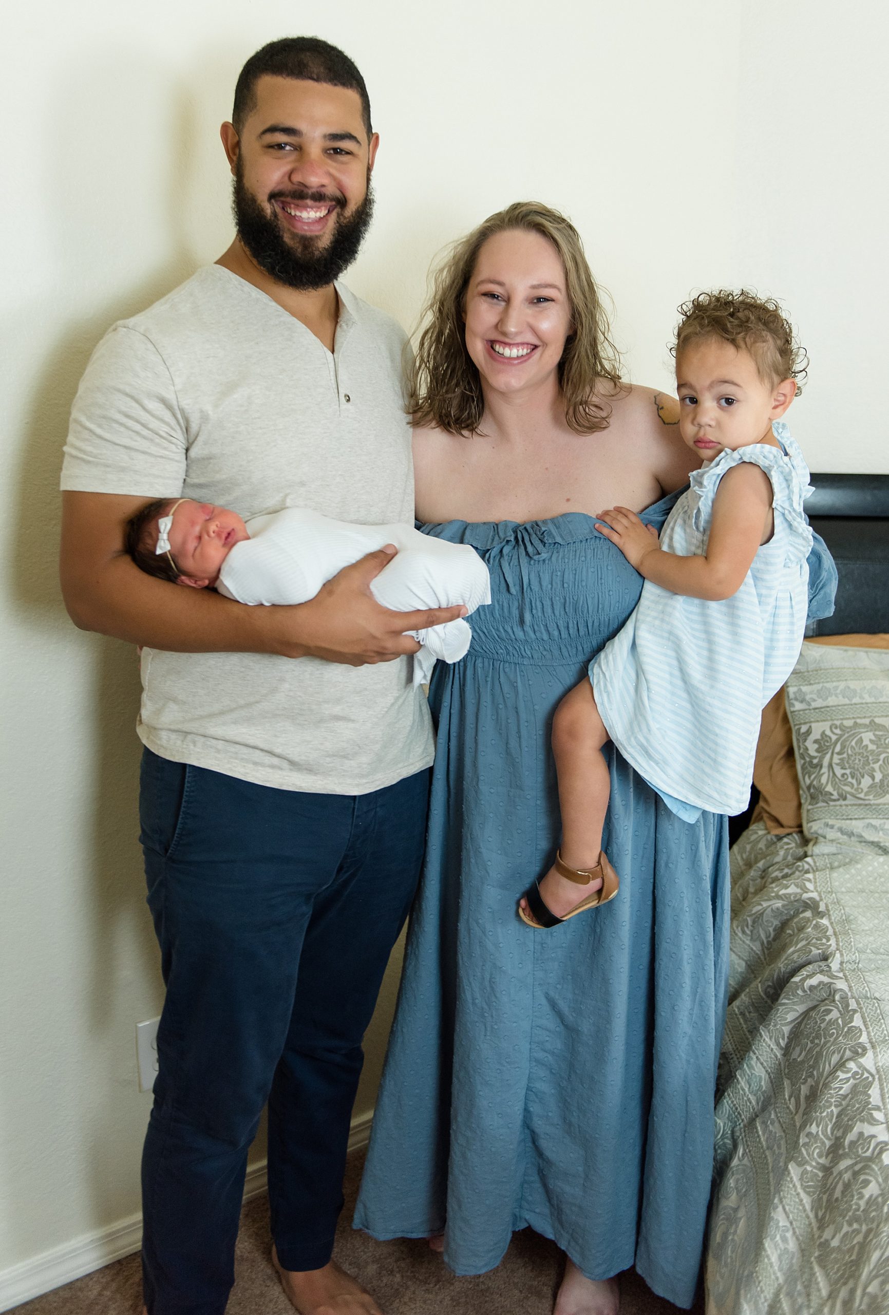 family of four during Carrollton Texas in-home newborn session