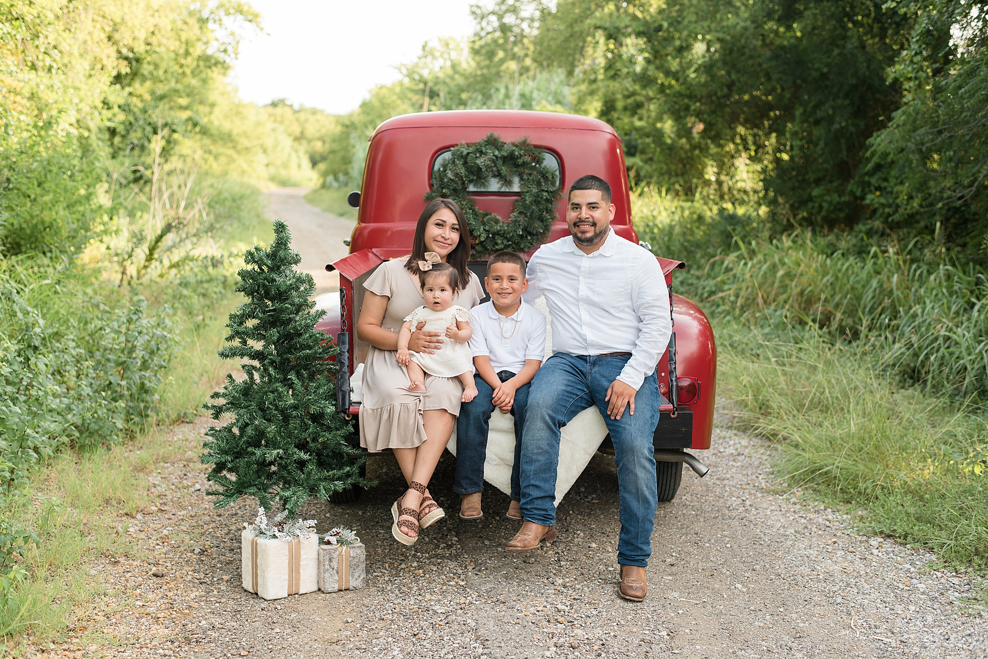 Little Elm Texas Family Portraits in red truck for christmas