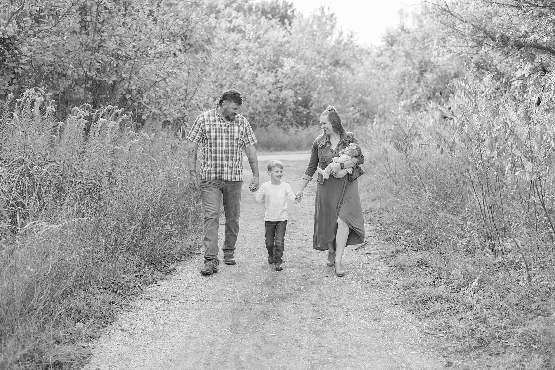 black and white photo of family of four in Frisco Texas