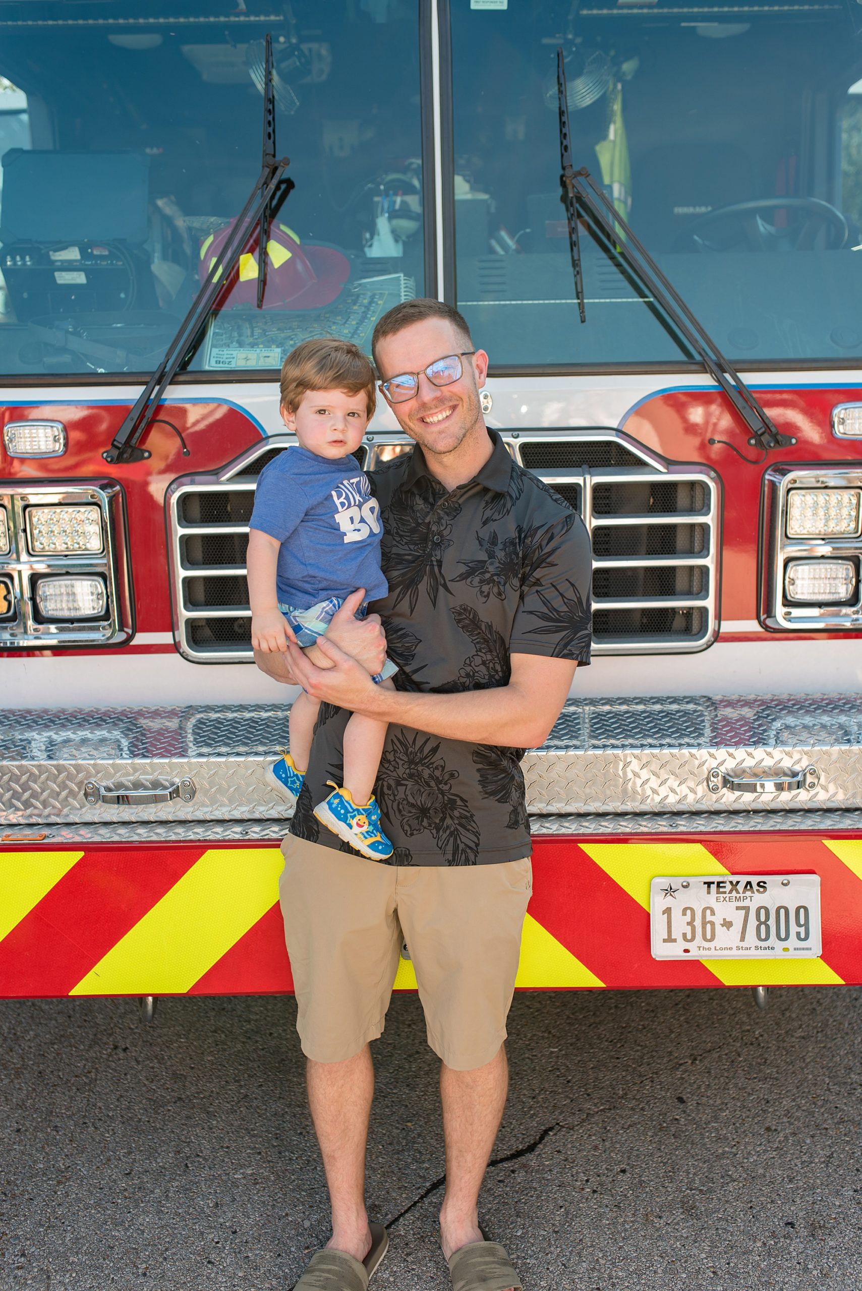 family portraits in front of fire truck at 2nd birthday