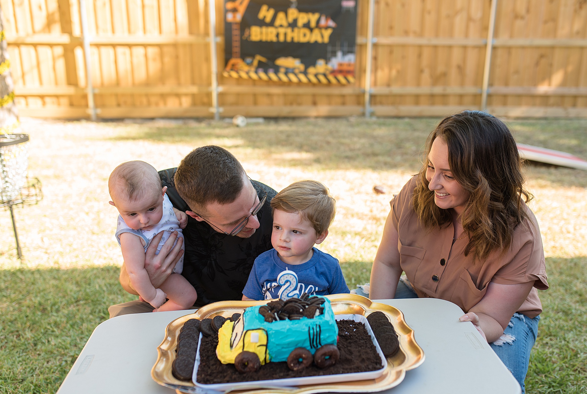 Little boy with his family Birthday Cake