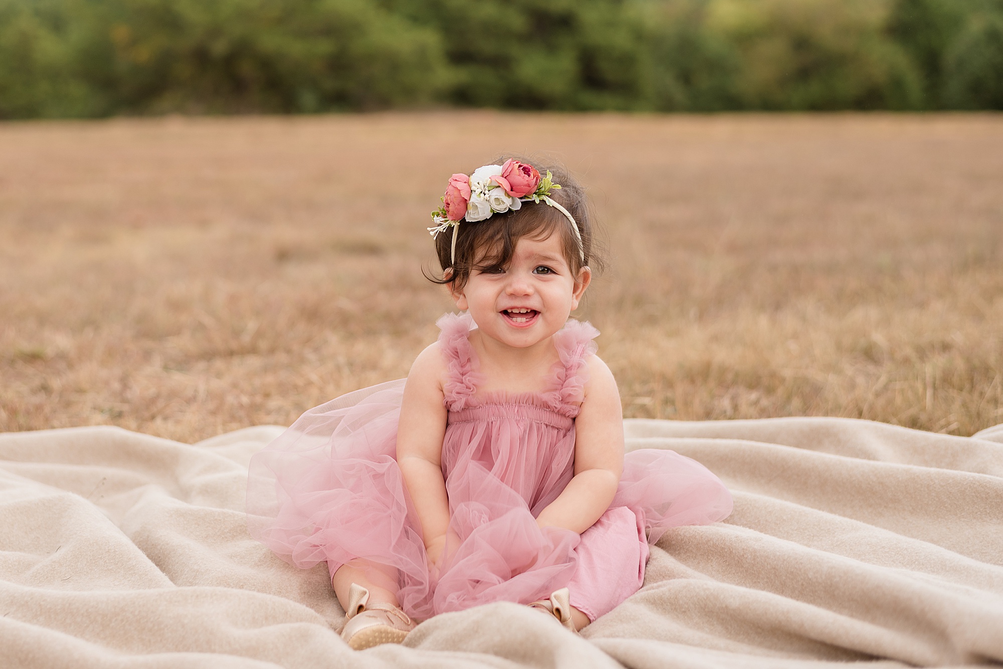 little girl in pink dress with flower headband  