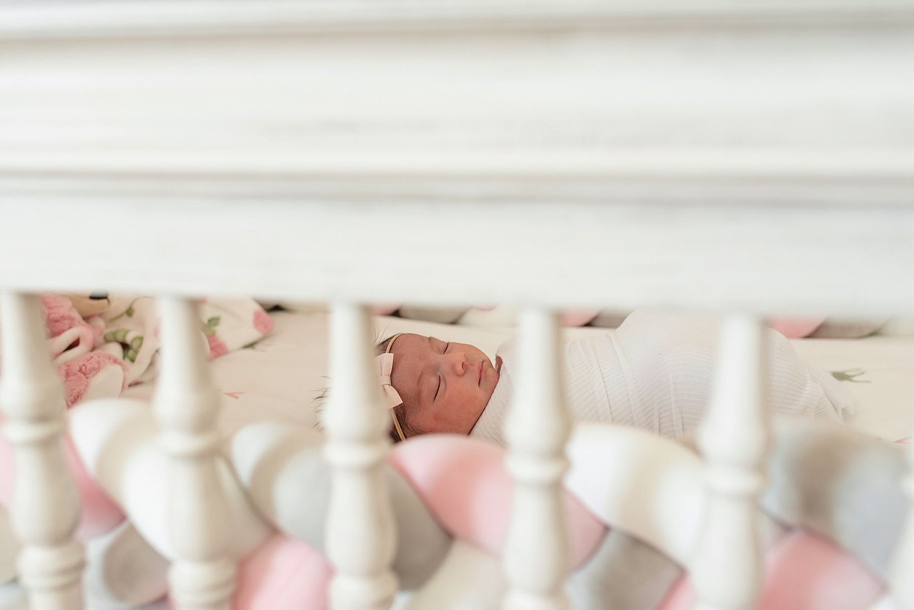 Pink and white nursery for newborn baby girl | In-Home Newborn Photo Session | Lindsey Dutton Photography | Dallas Area Family Photographer | newborn session, newborn posing ideas, newborn photos, girl nursery inspiration | via lindseyduttonphotography.com