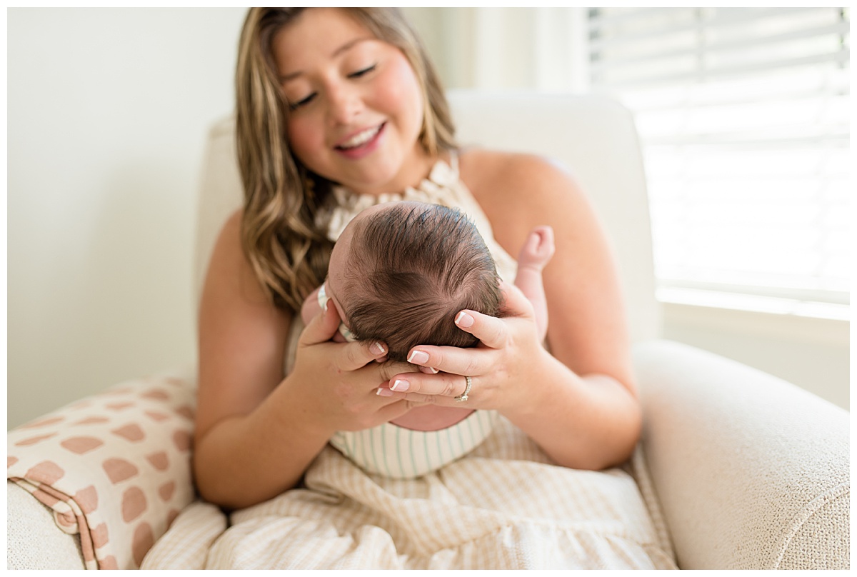 Mom with baby during lifestyle newborn photo session.  Photographed by Dallas newborn photographer Lindsey Dutton Photography