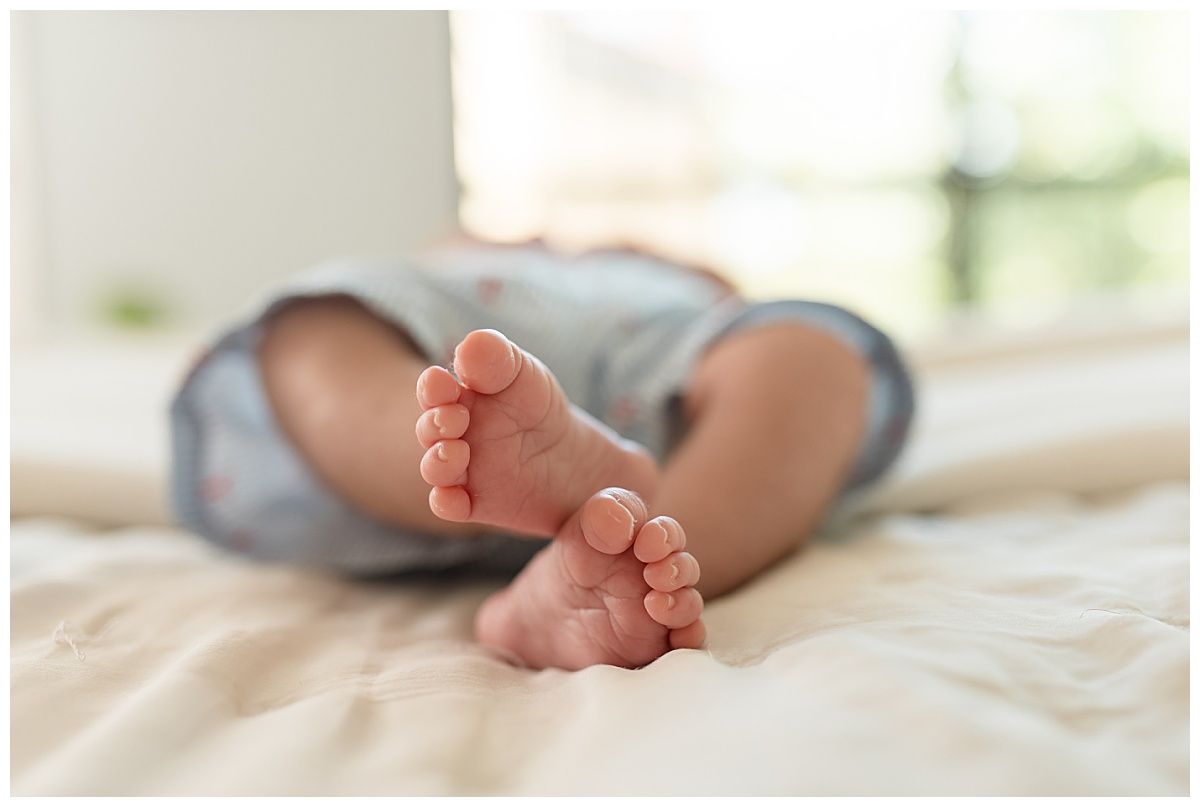 Newborn baby toes during a lifestyle newborn photo session. Photographed by Dallas newborn photographer Lindsey Dutton Photography