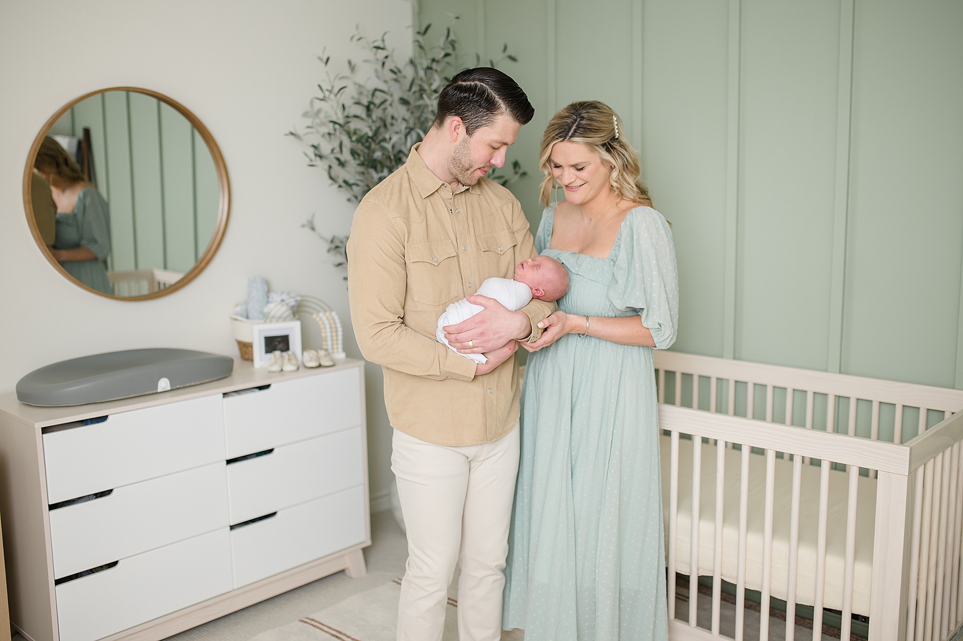new parents hold their baby boy photographed by Lindsey Dutton Photography, a Dallas Newborn photographer
