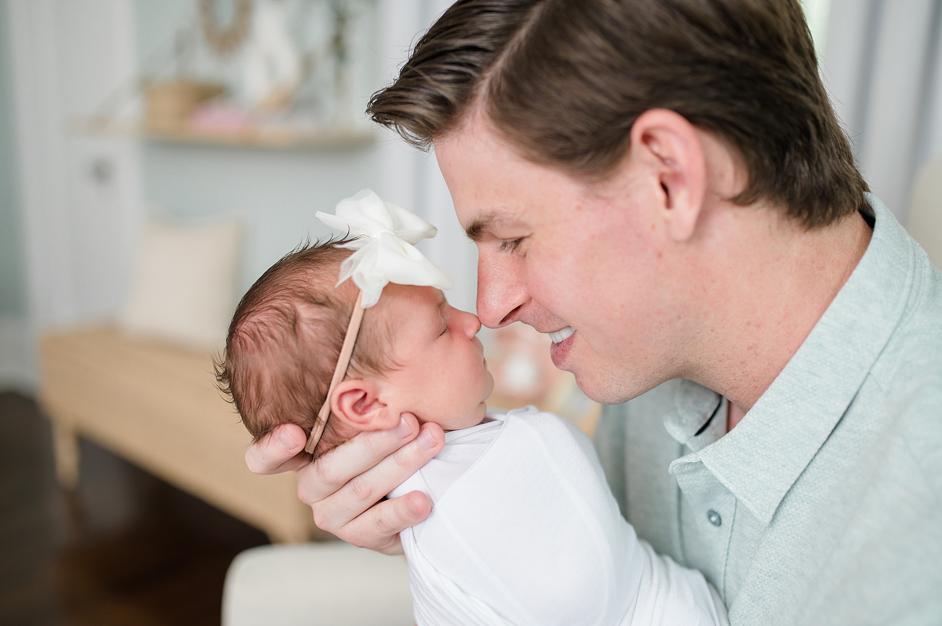 dad snuggles his baby girl photographed by Lindsey Dutton Photography, a Dallas Newborn Photographer