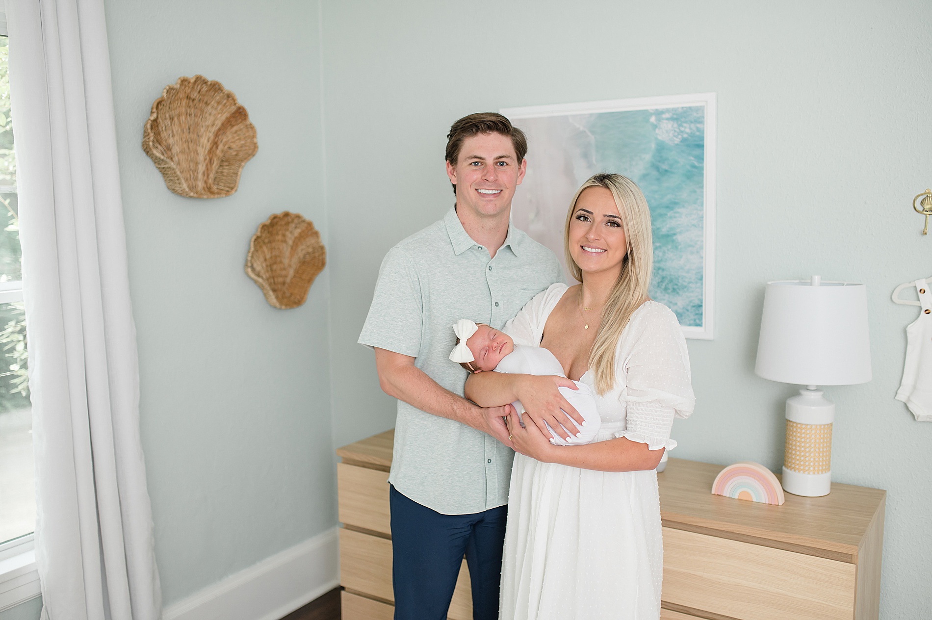 parents hold baby girl in nursery during in-home newborn session photographed by Dallas Newborn Photographer, Lindsey Dutton Photography
