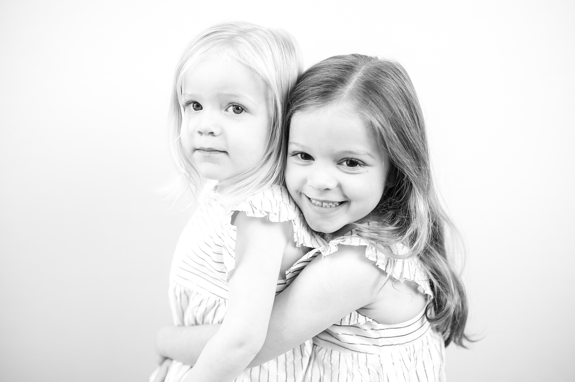 Black and White Studio Portraits of siblings photographed by Lindsey Dutton Photography, a Dallas family photographer
