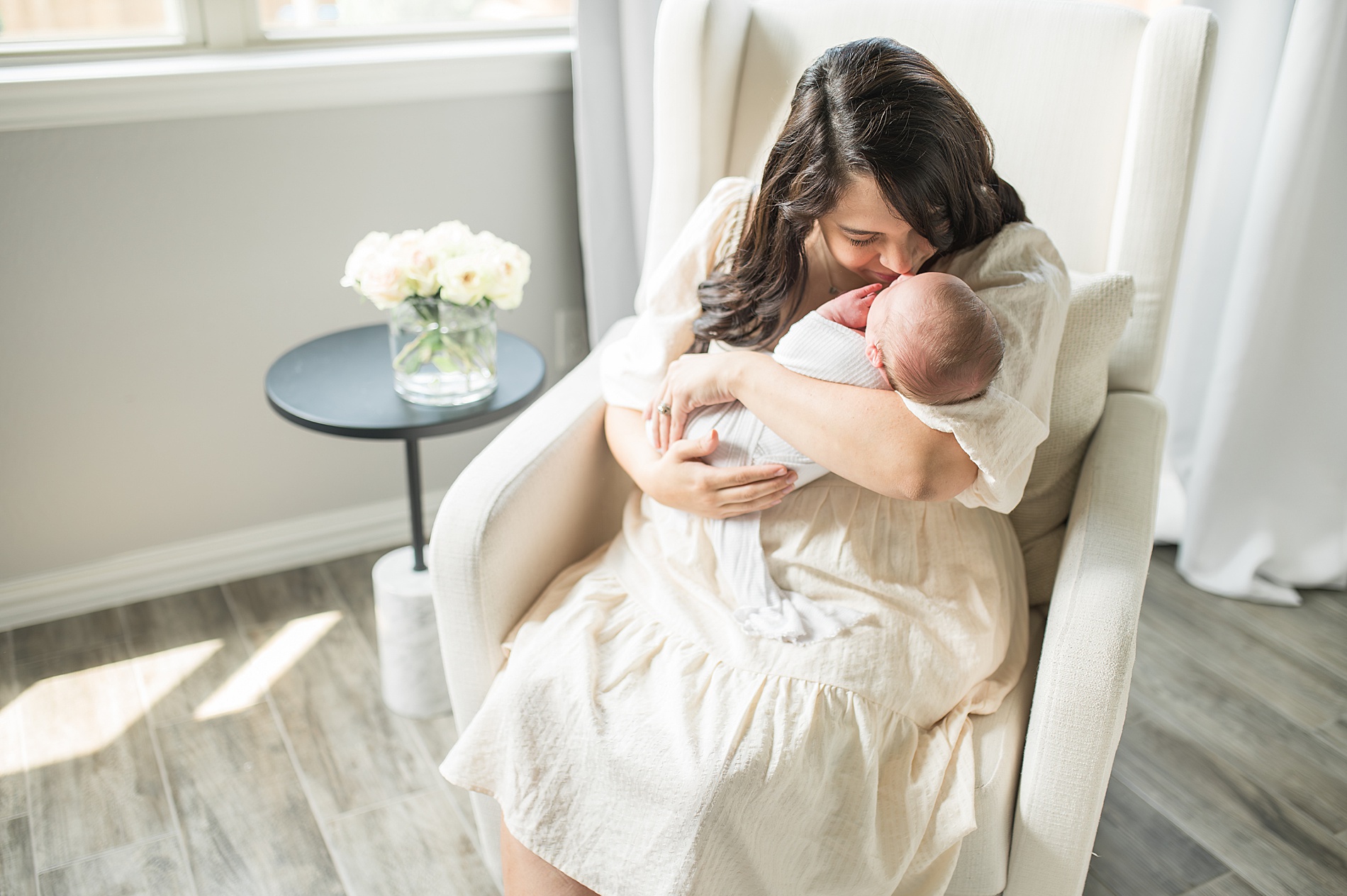 mom kisses her newborn photographed by Lindsey Dutton Photography, Dallas Newborn photographer