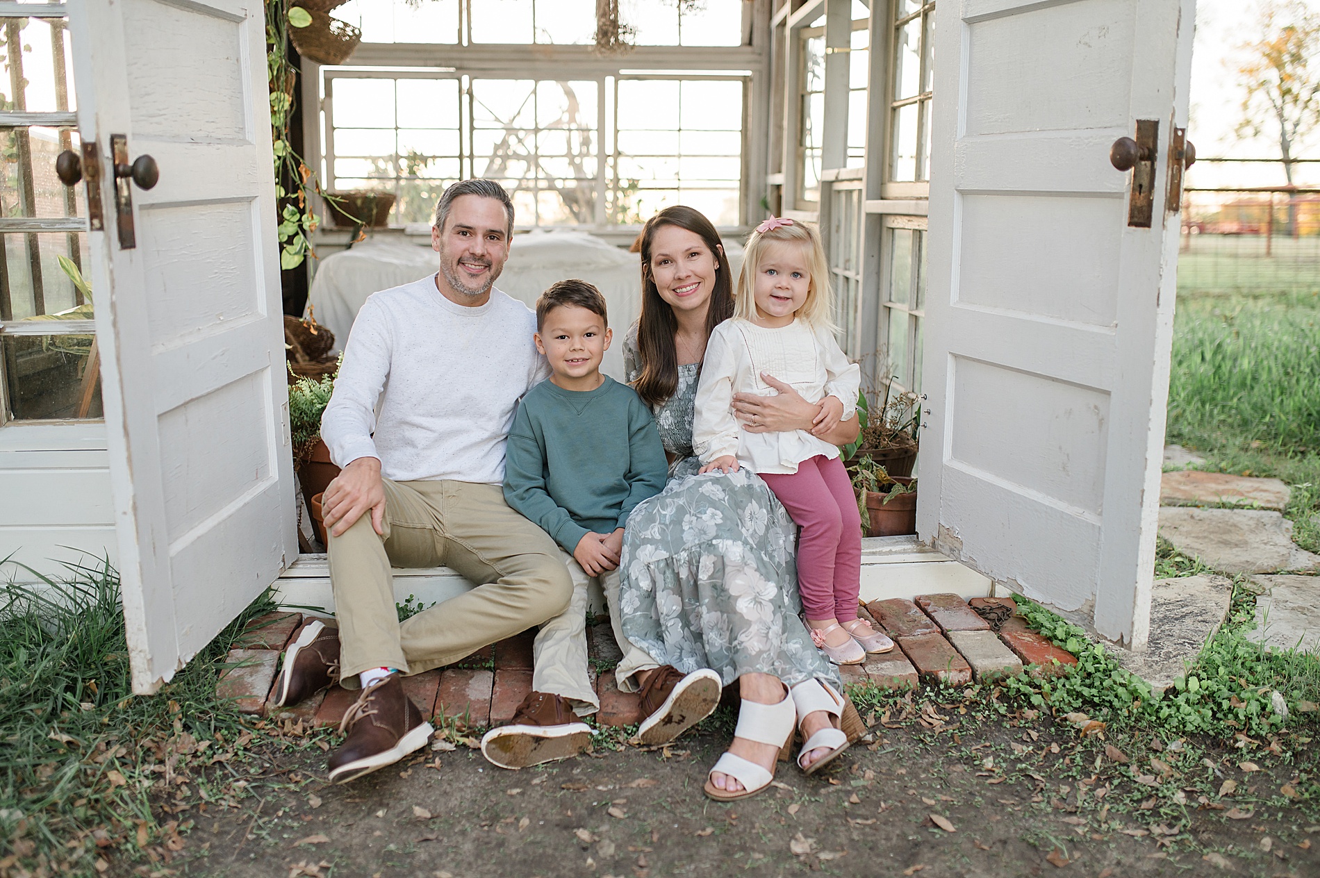 famiy of four at the Little glass shack in Howe, TX photographed by Lindsey Dutton Photography, a Dallas Family photographer
