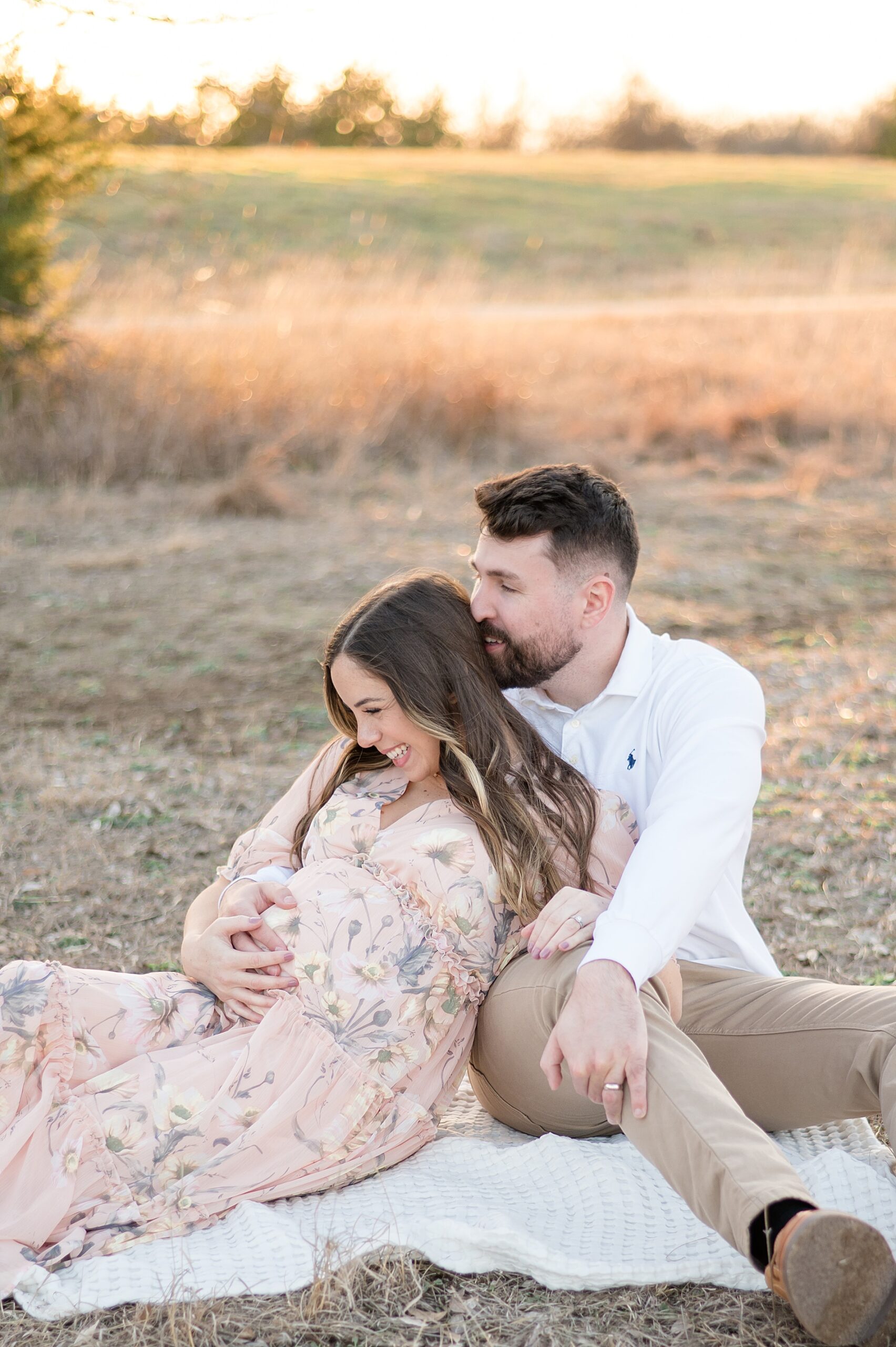 expectant couple sit on blanket at Arbor Hills taken by Lindsey Dutton Photography, a Dallas maternity photographer
