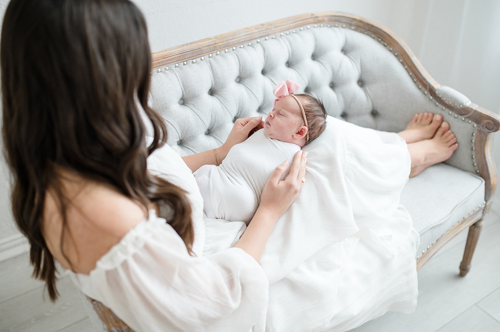 mom admires newborn girl photographed by Lindsey Dutton Photography, a Dallas newborn photographer
