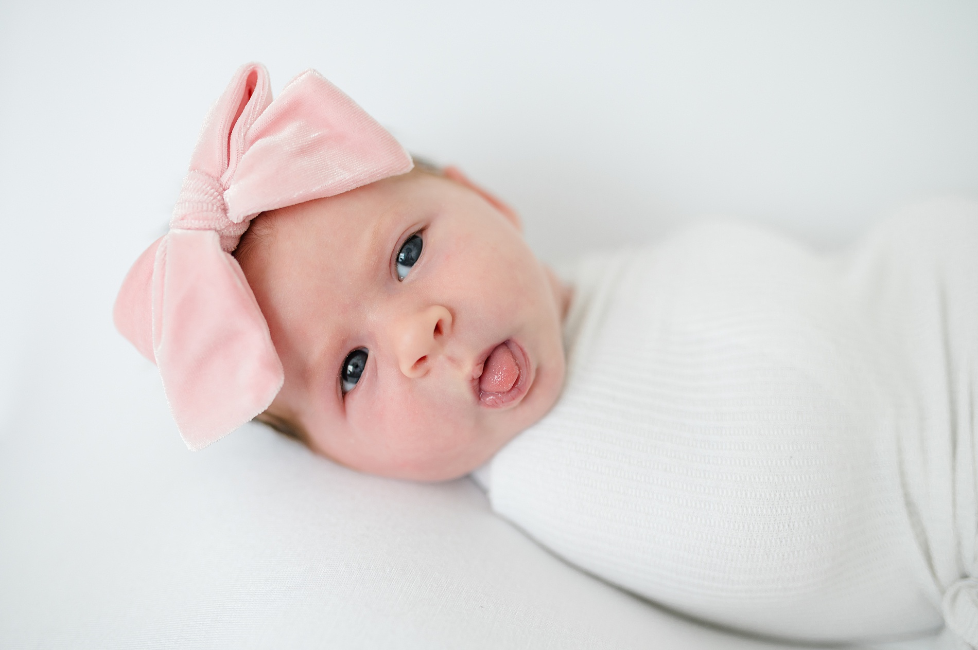 Why I Use White in Newborn Photos to highlight the features of newborns photographed by Lindsey Dutton Photography, a Dallas newborn photographer
