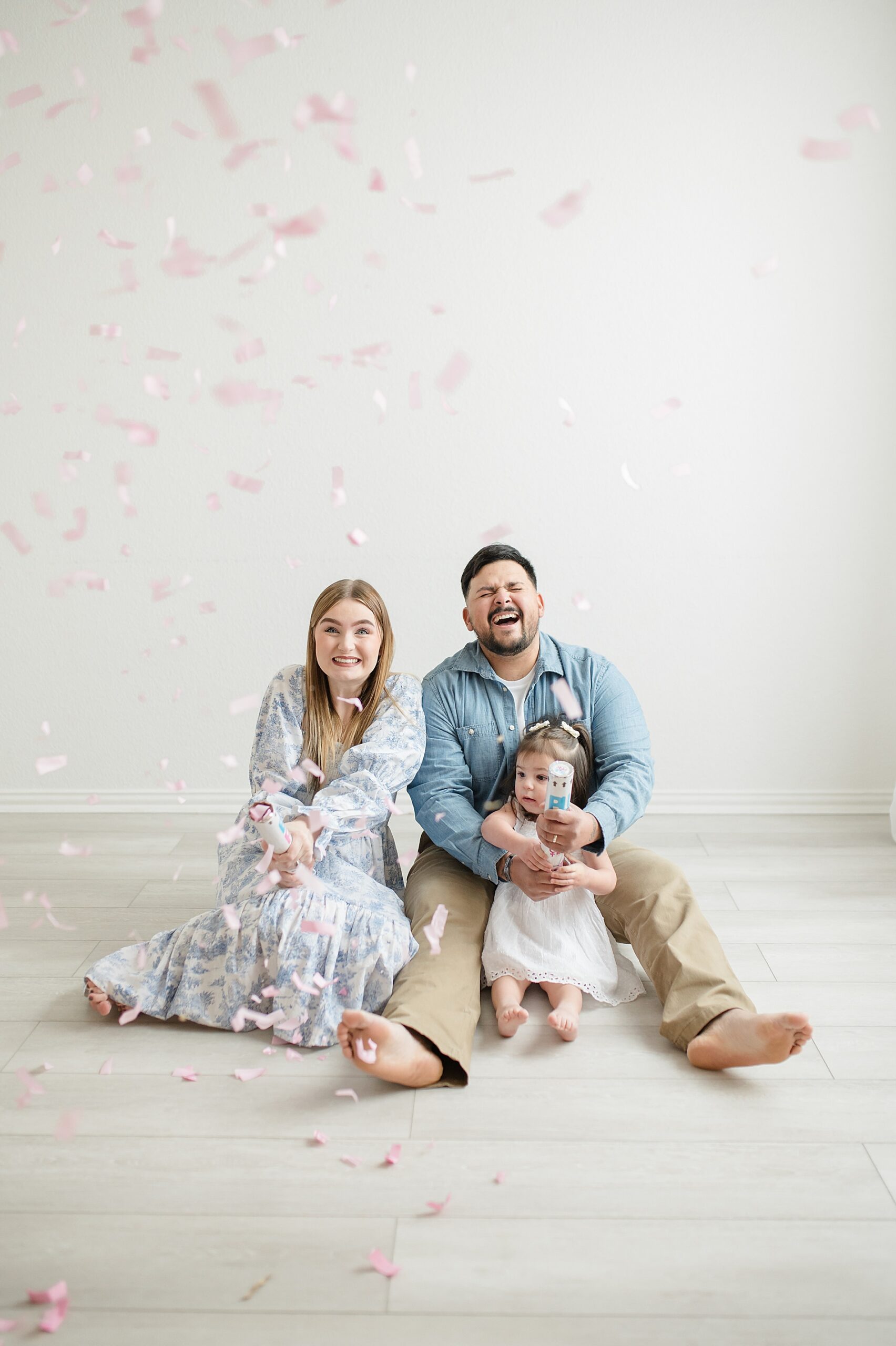 Gender reveal with popper and confetti 5 Benefits of Gender Reveal Sessions photographed by Lindsey Dutton Photography, a Dallas Maternity photographer