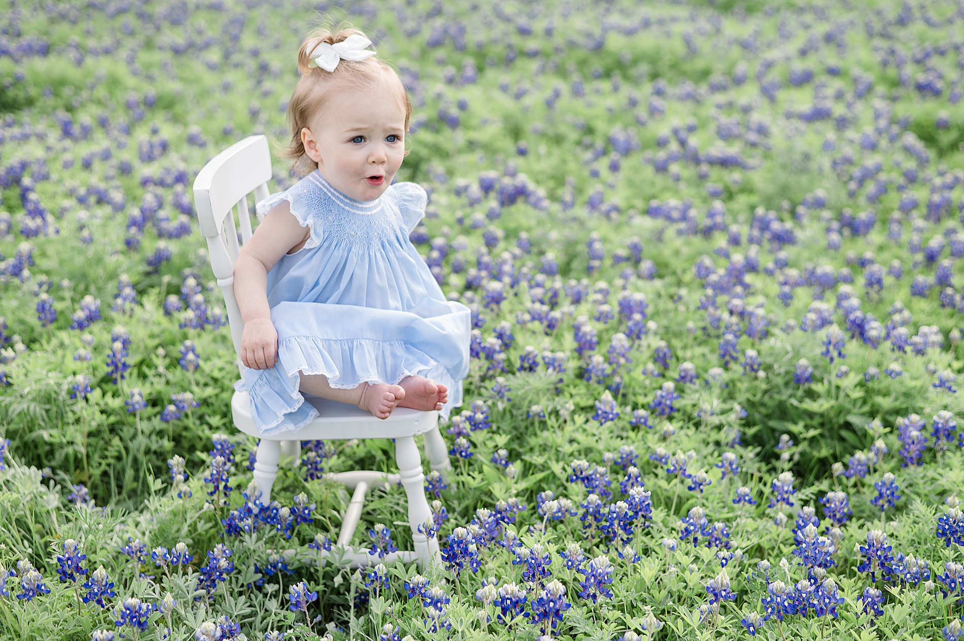 candid portraits of little girl during Dallas Texas Bluebonnet Photos taken by Lindsey Dutton Photography, a Dallas family photographer