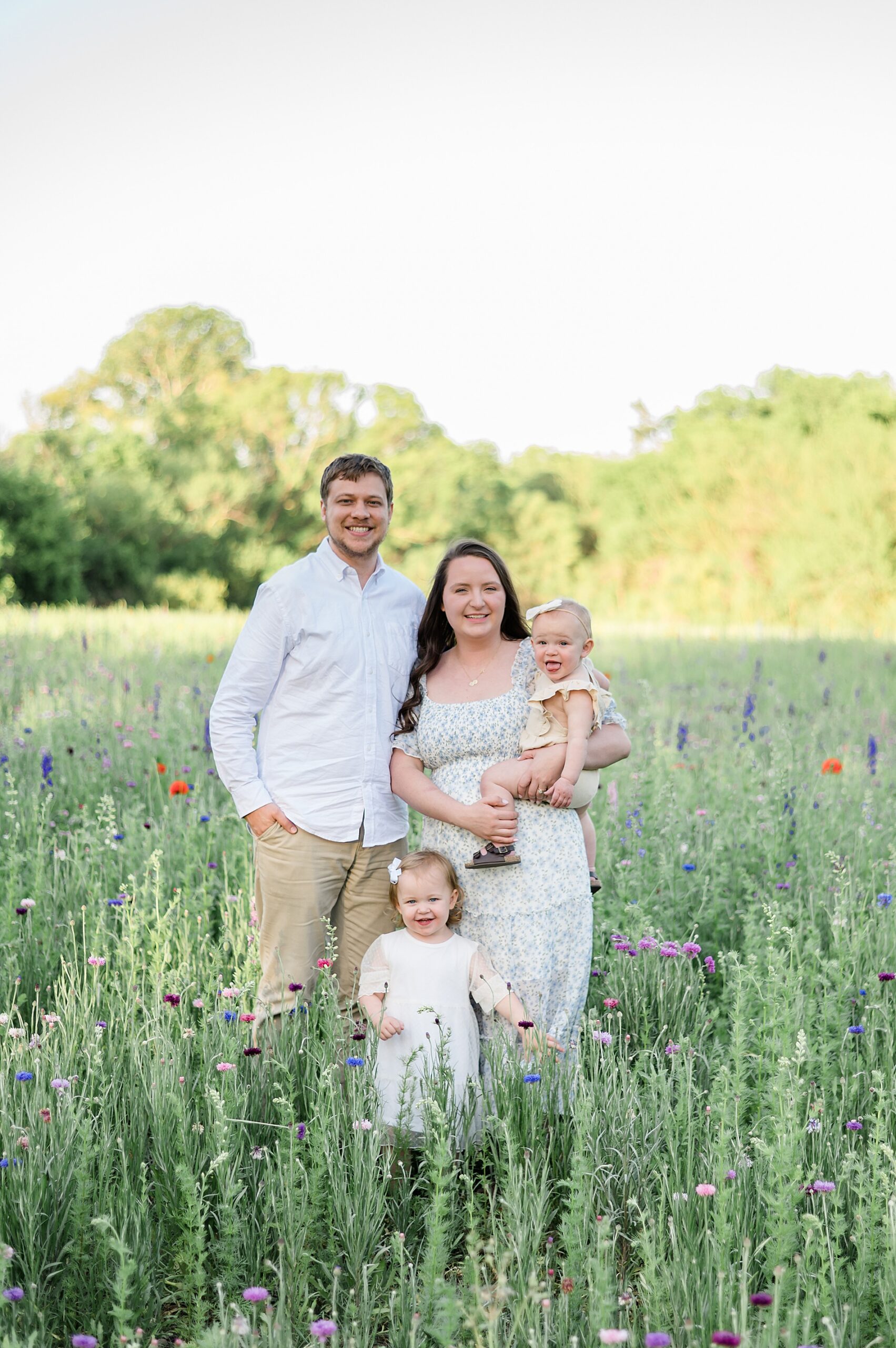 Family photos in field of wildflowers taken by Lindsey Dutton Photography, a Dallas family photographer