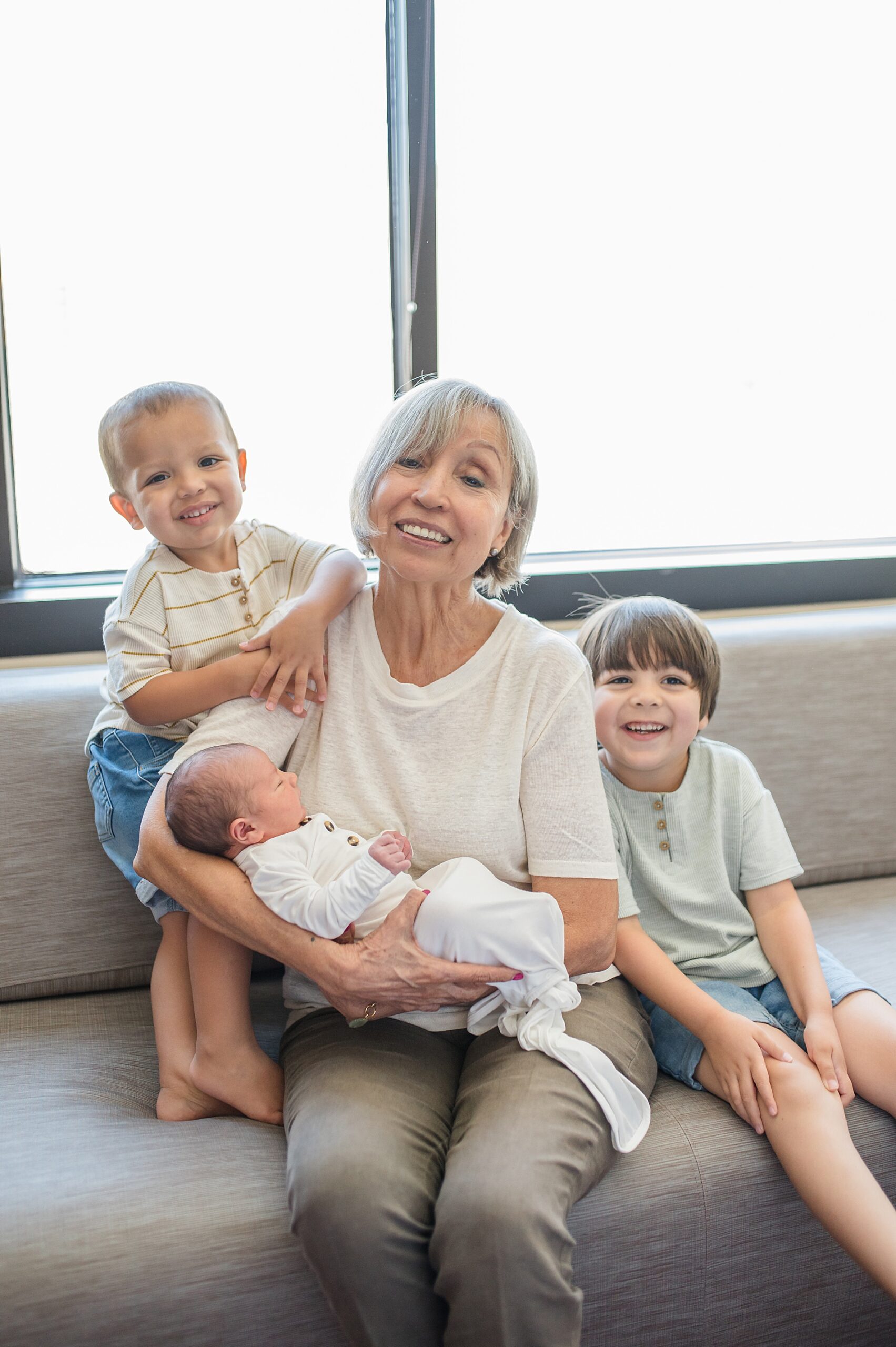 The Difference Between Fresh 48 and Newborn Sessions | grandma with her grandchildren taken by Lindsey Dutton Photography, a Dallas newborn photographer