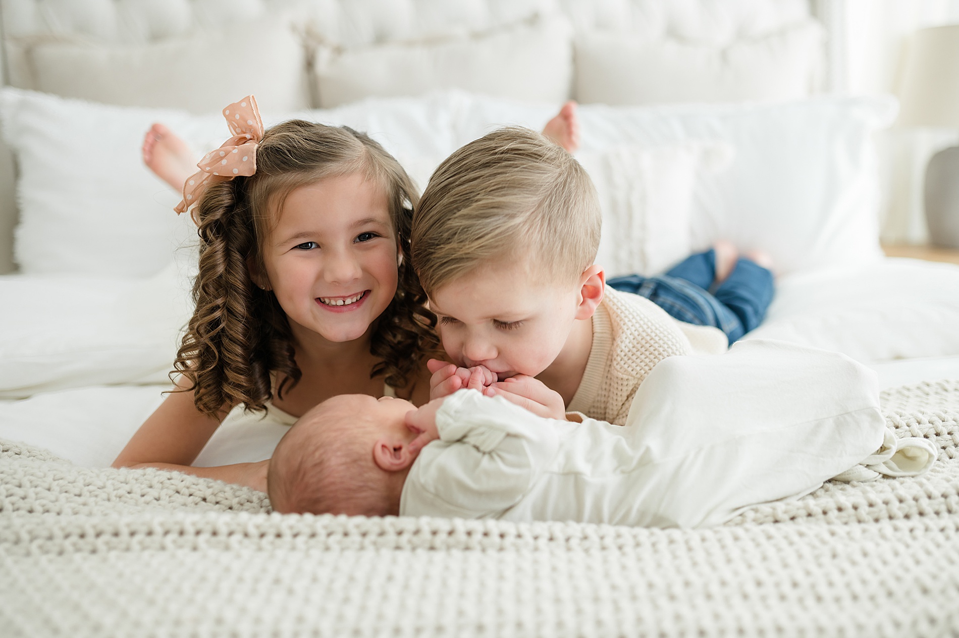 siblings with their baby brother from newborn session photographed by Lindsey Dutton Photography, a Dallas newborn photographer
