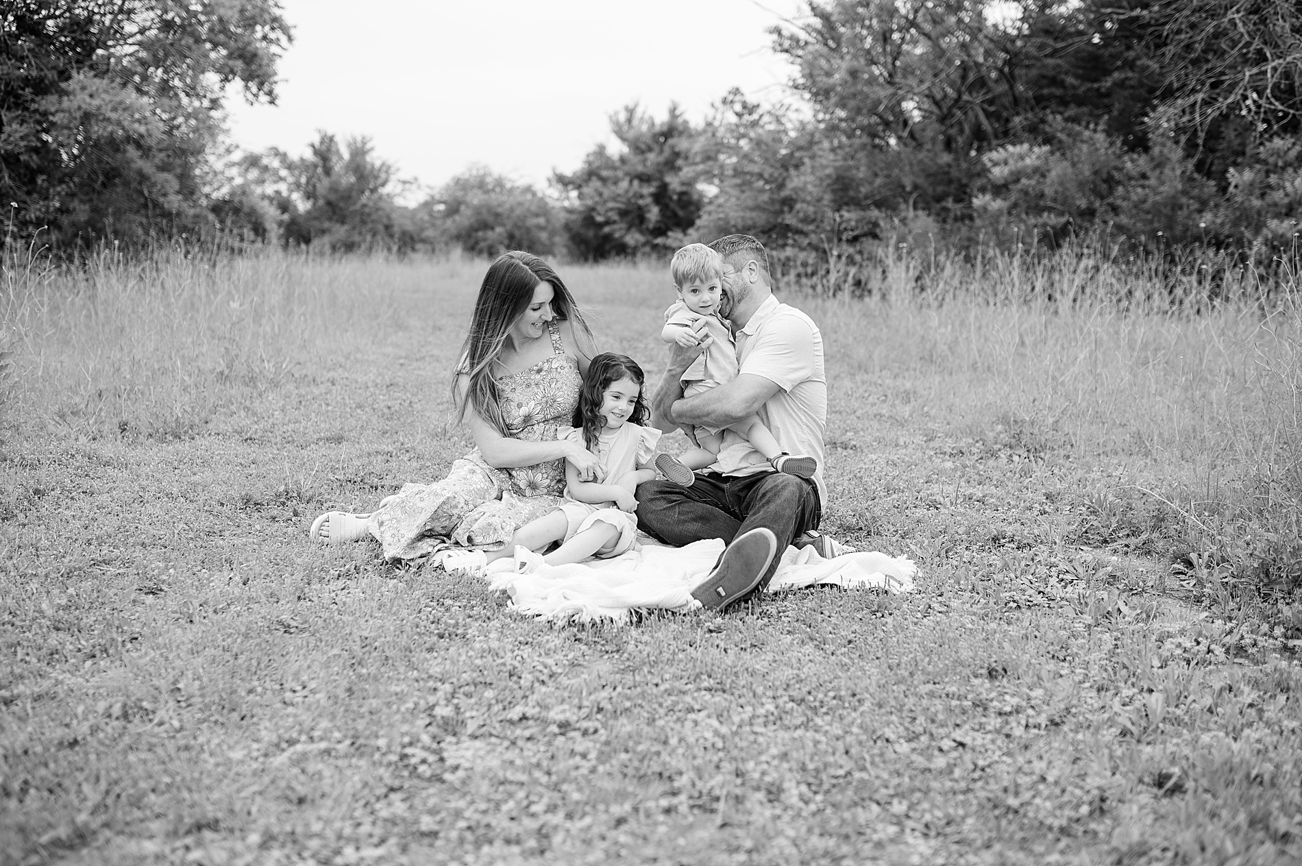 timeless family photo of family on blanket taken by Lindsey Dutton Photography, a Dallas family photographer
