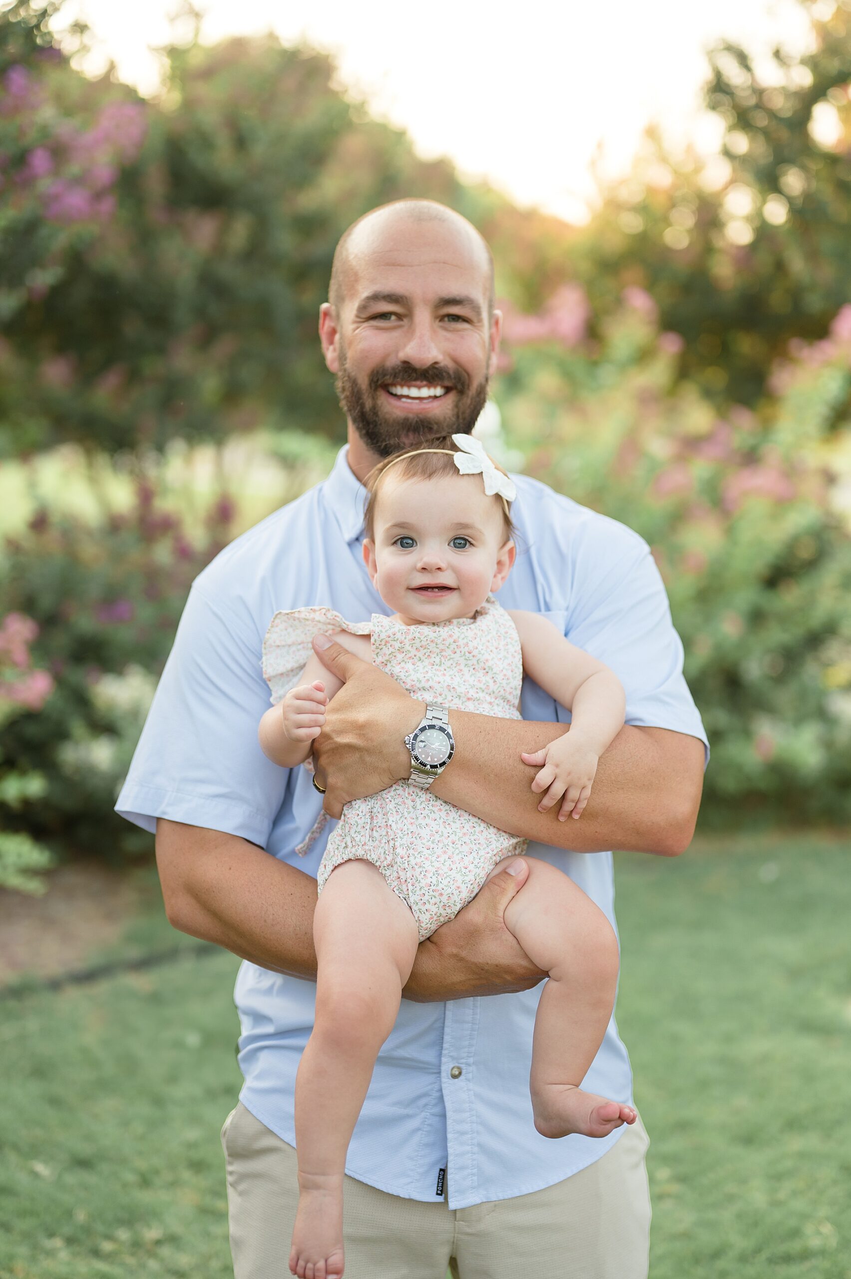 dad holds his baby girl photographed by Lindsey Dutton Photography, a Dallas family photographer
