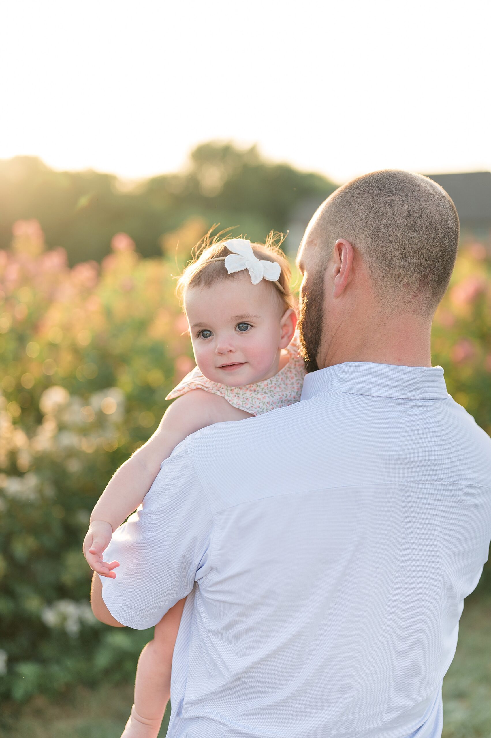 dad holds his baby girl taken by Lindsey Dutton Photography, a Dallas family photographer
